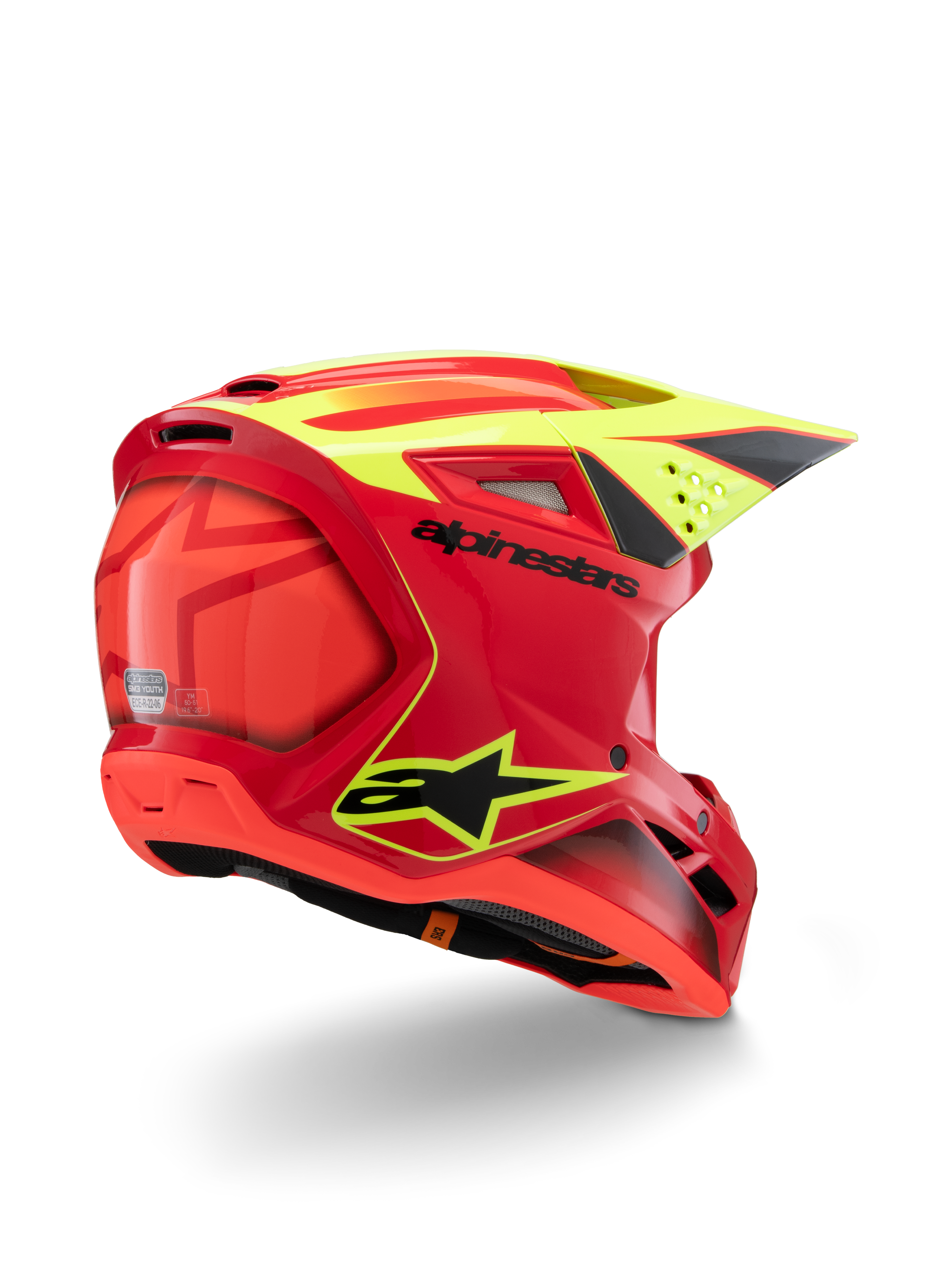 Casco Alpinestars S-M3 Youth Fray, rojo y amarillo flúor brillante, vista trasera en tres cuartos, con logotipos negros destacados y ventilaciones aerodinámicas, casco de motocross juvenil de alta visibilidad