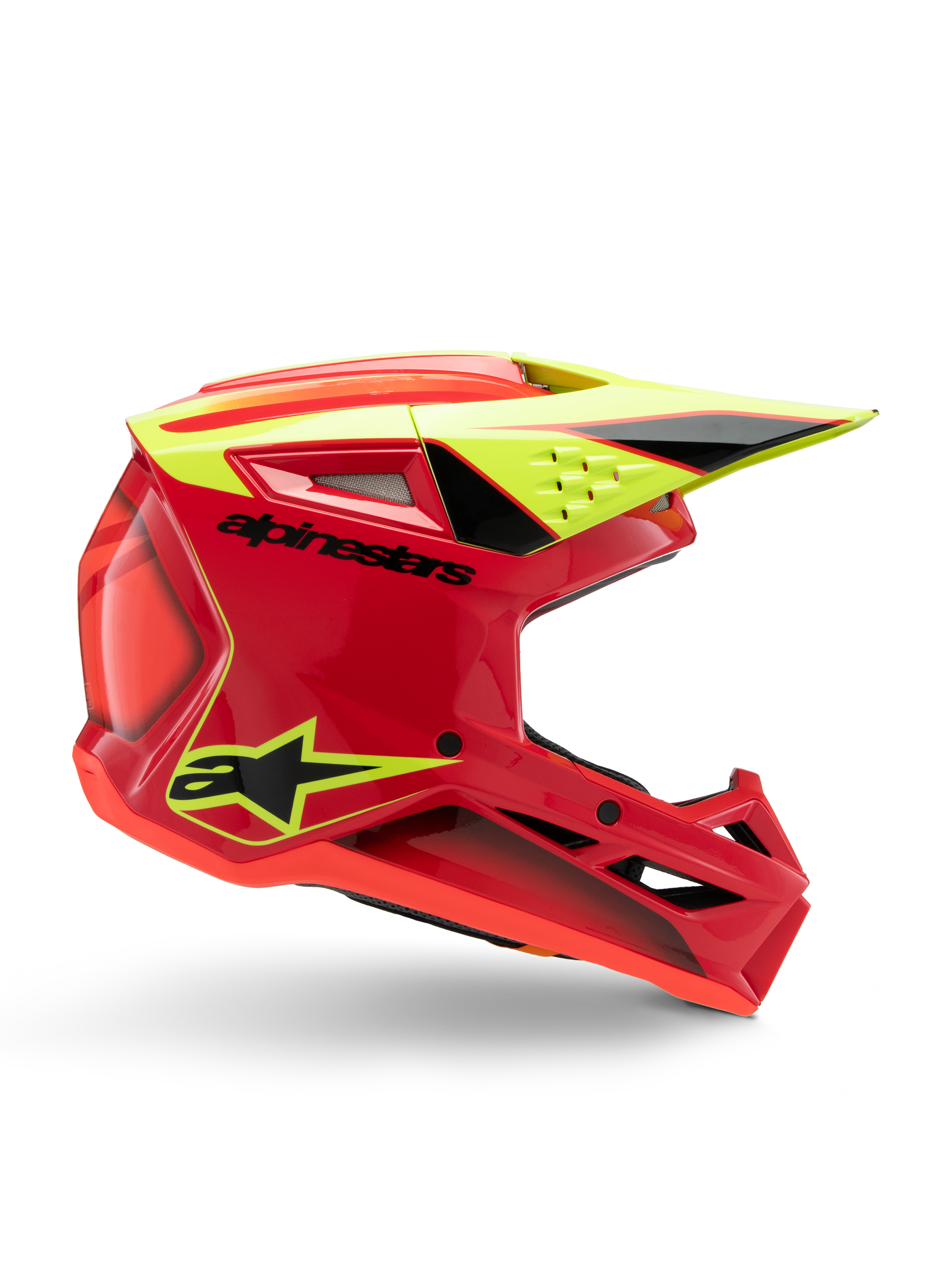 Casco Alpinestars S-M3 Youth Fray, casco de motocross, rojo, amarillo flúor y negro brillante, vista de perfil lateral que muestra un diseño aerodinámico con visera integrada y rejillas de ventilación prominentes, logotipo negro sobre una calota roja vibrante, optimizado para el rendimiento off-road juvenil