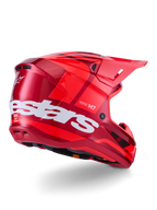 Casco Alpinestars S-M7 Core, casco de motocross, rojo brillante con un gran logotipo blanco de Alpinestars en el lateral, calota aerodinámica, puertos de ventilación integrados y visera protectora, vista posterior 3/4