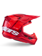 Casco Alpinestars S-M7 Core, casco de motocross, rojo brillante con detalles en rojo oscuro y logotipos en blanco, vista lateral con un gran logotipo de estrellas en blanco, calota aerodinámica con puertos de ventilación de malla y una visera prominente