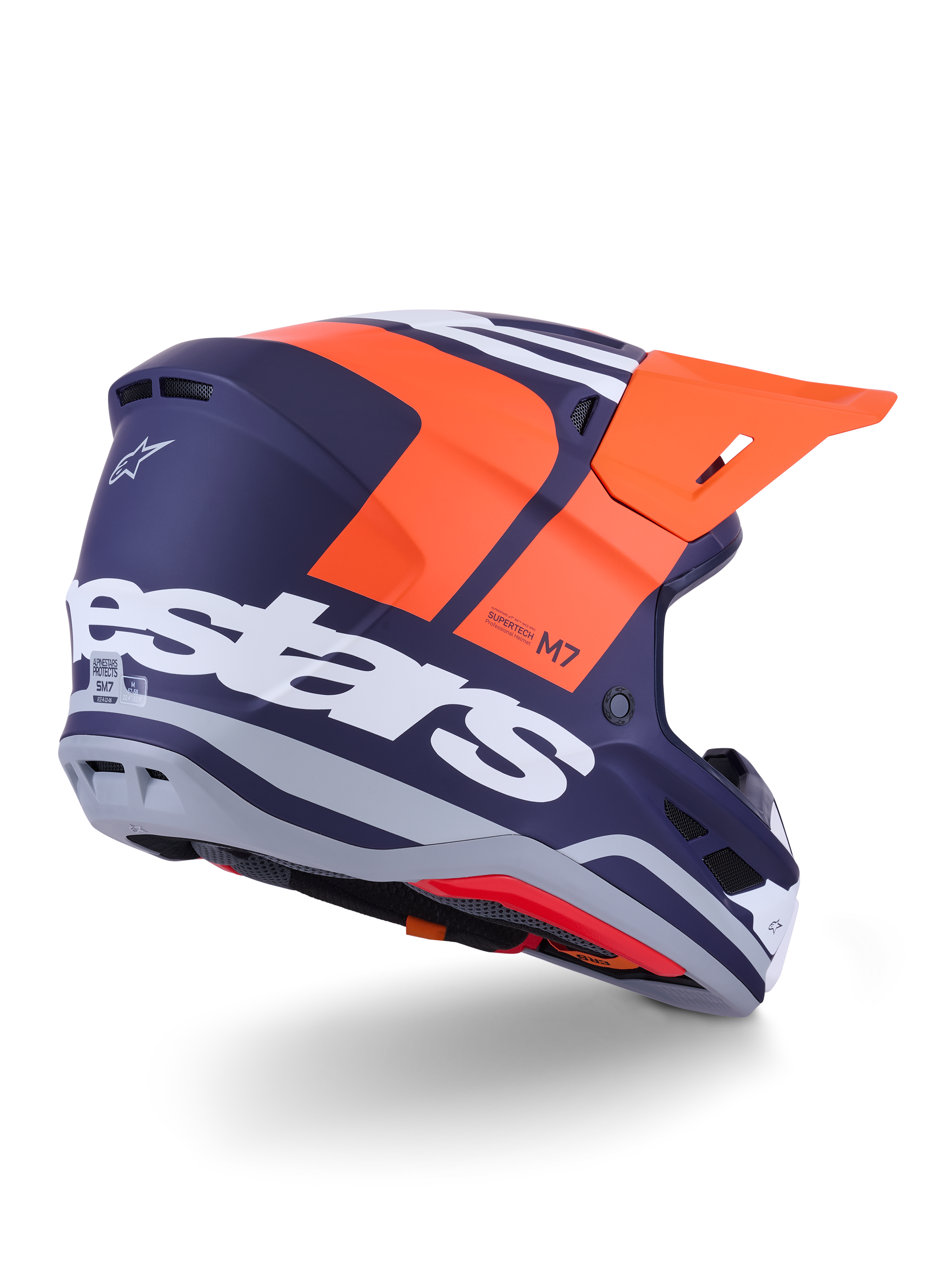 Casco Alpinestars S-M7 Core, casco de motocross, naranja y azul mate, vista trasera-lateral con el logotipo de Alpinestars en blanco llamativo en la parte trasera, visera naranja brillante, calota de composite aerodinámica con detalles en gris, protección profesional para competición off-road