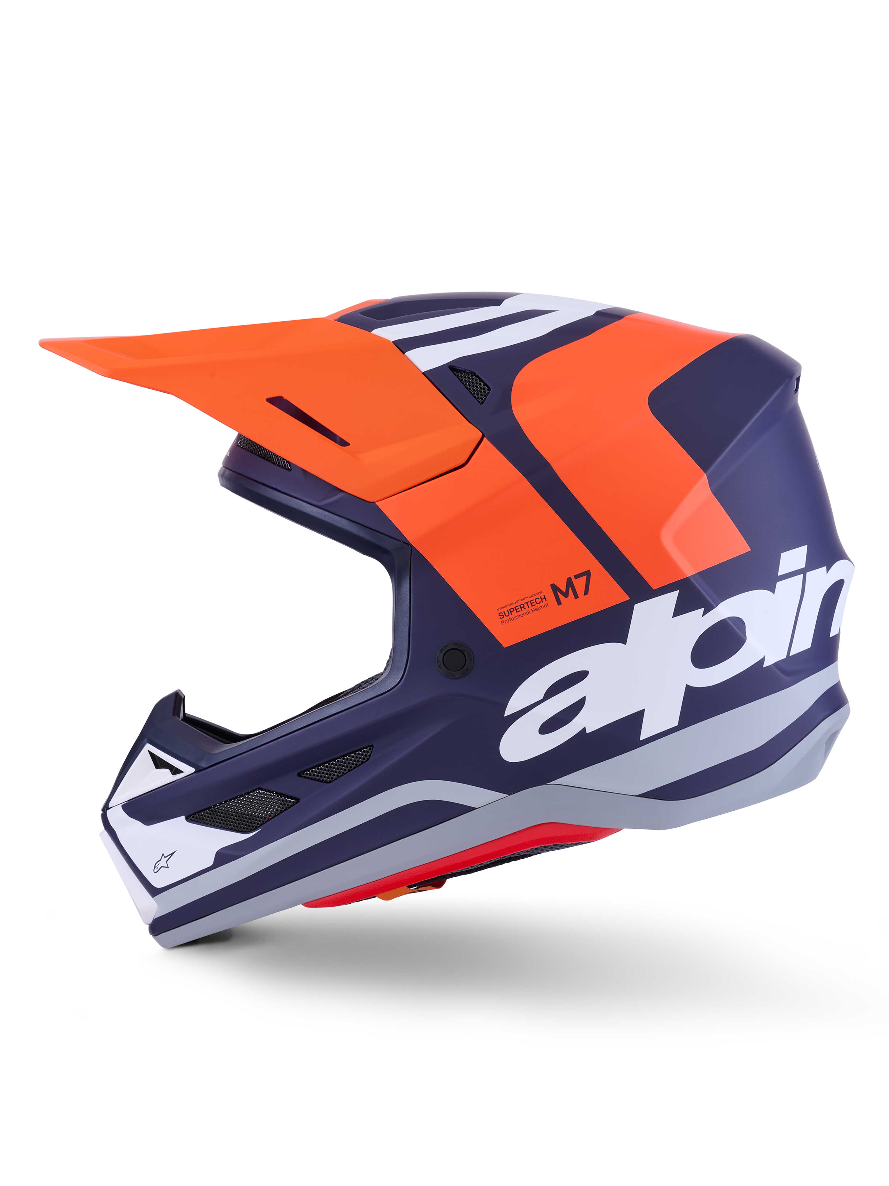 Casco Alpinestars S-M7 Core ECE 22.06, perfil lateral, acabado mate en azul marino y naranja, gran logotipo blanco en el lateral, casco aerodinámico de motocross con visera protectora