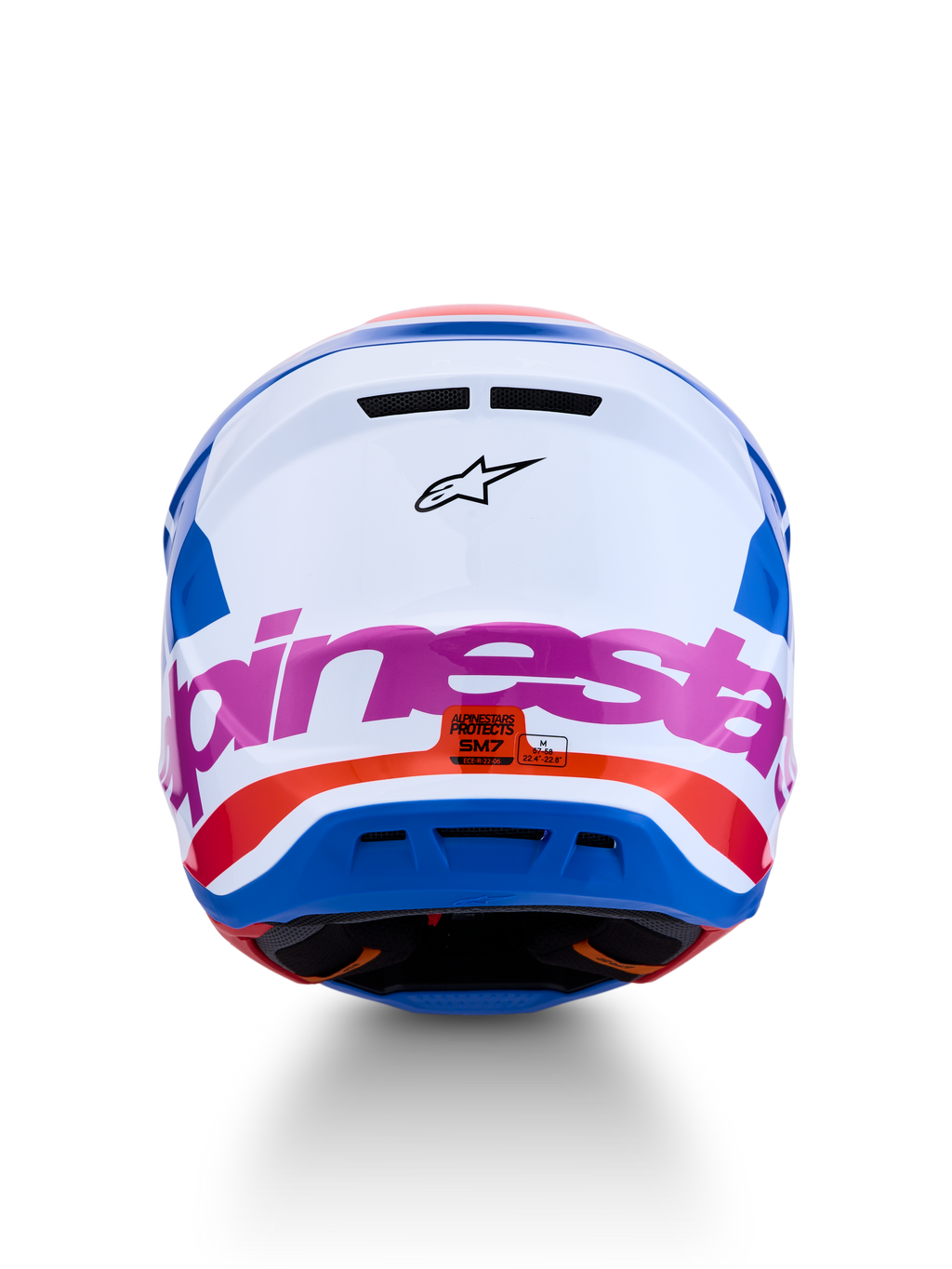 Casco Alpinestars S-M7 Core ECE06, casco de motocross para off-road, blanco y azul con detalles en rosa y naranja, certificado ECE 22.06, vista trasera