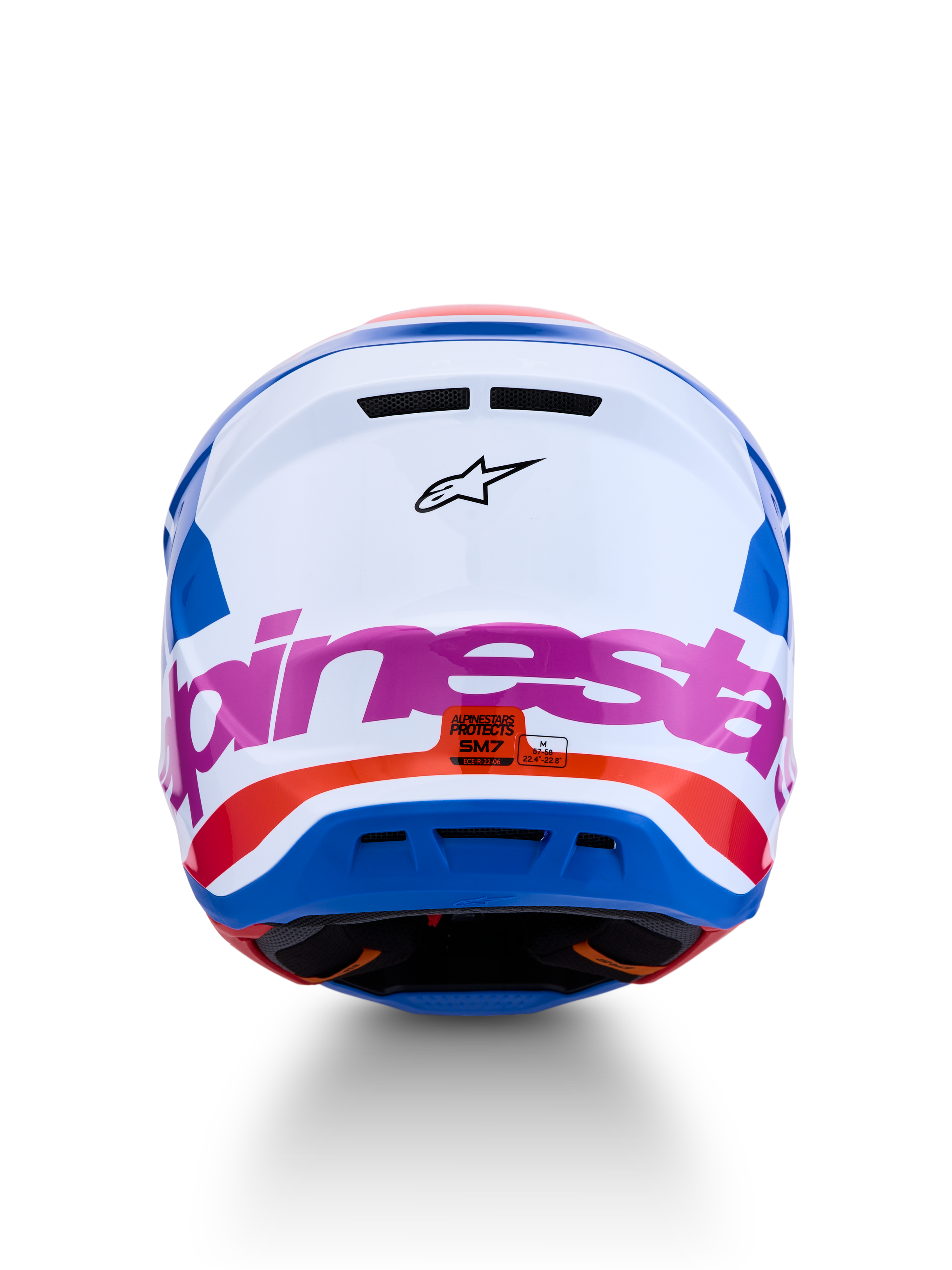 Casco Alpinestars S-M7 Core ECE06, casco de motocross para off-road, blanco y azul con detalles en rosa y naranja, certificado ECE 22.06, vista trasera