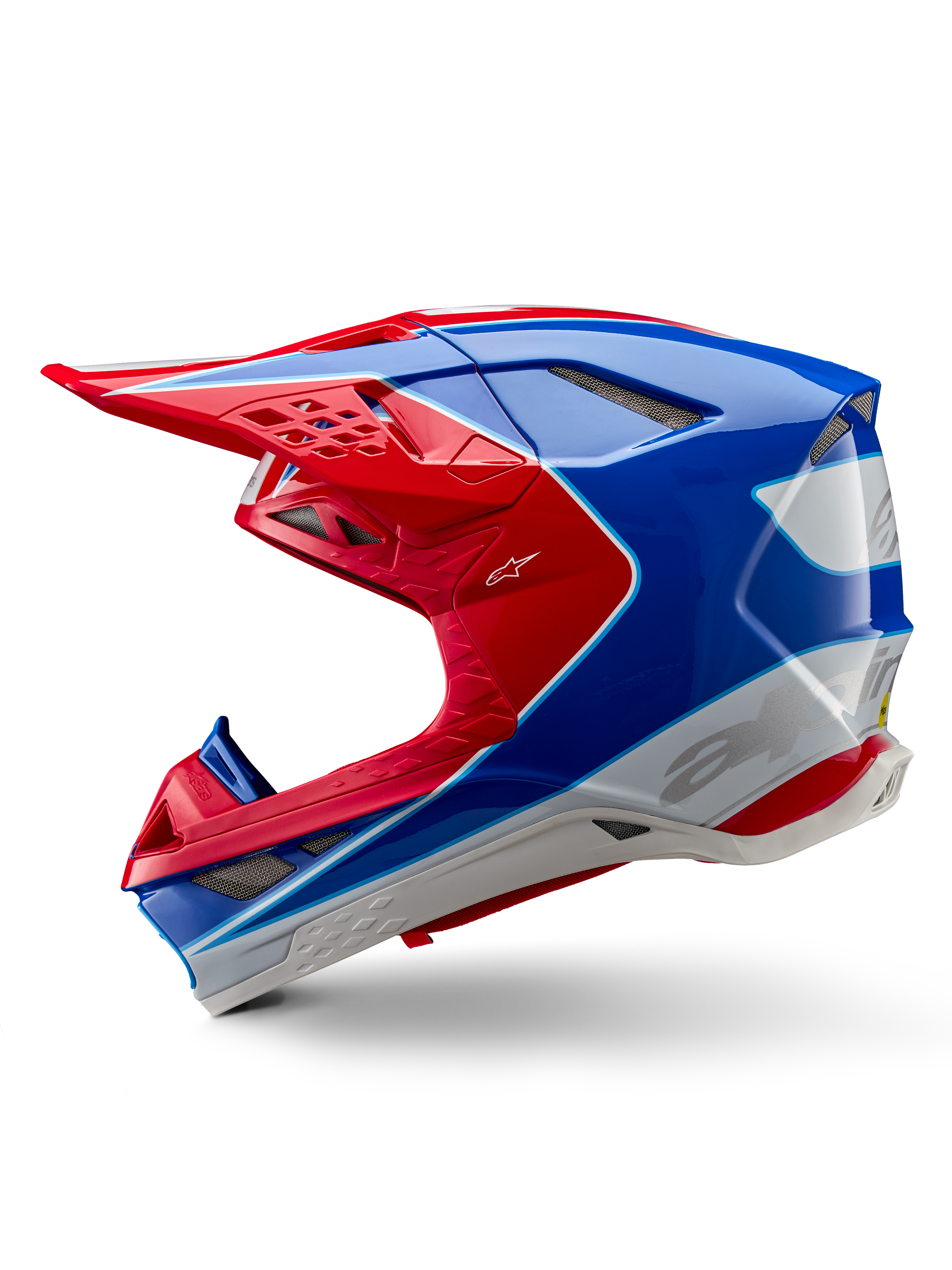 Casco Alpinestars Supertech M10 Aeon ECE 22.06, casco de motocross, rojo y azul brillante, vista de perfil lateral, carcasa aerodinámica de compuesto múltiple con puertos de ventilación integrados y diseño gráfico en rojo y azul, acabado brillante para carreras todoterreno