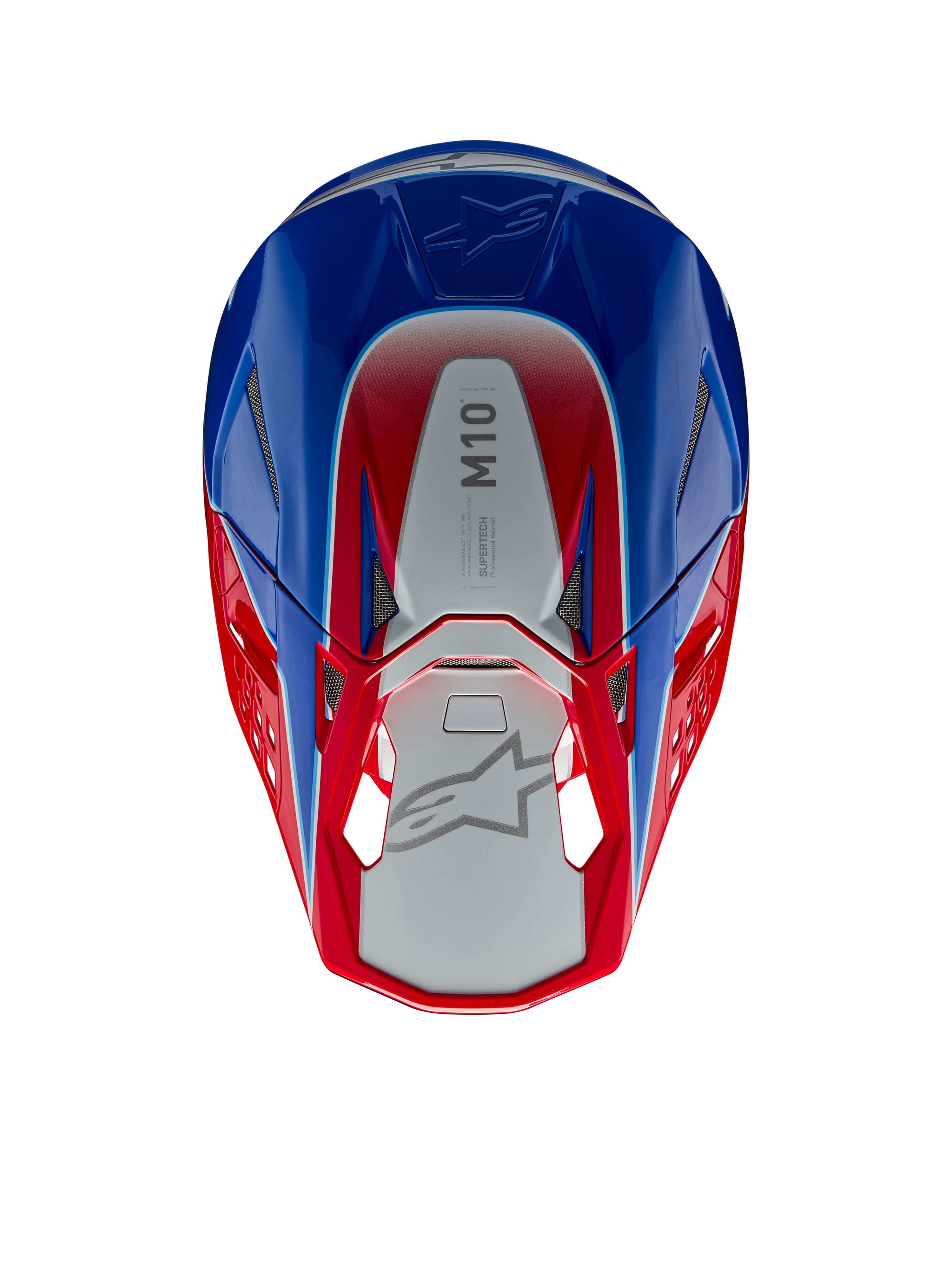 Casco Alpinestars Supertech M10 Aeon, casco de motocross, rojo y azul brillante, vista superior que muestra el panel central plateado con la marca M10, calota aerodinámica con detalles en rojo y azul, puertos de ventilación de malla, protección para la cabeza de motocross de alto rendimiento