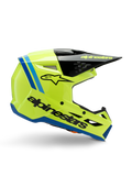 Alpinestars S-M3 Youth Radium Helmet, casco de motocross juvenil, amarillo flúor brillante con detalles en negro y azul, vista lateral que muestra el diseño aerodinámico, visera negra con logotipo amarillo, marca negra llamativa en el lateral, protección certificada ECE 22.06 para carreras off-road