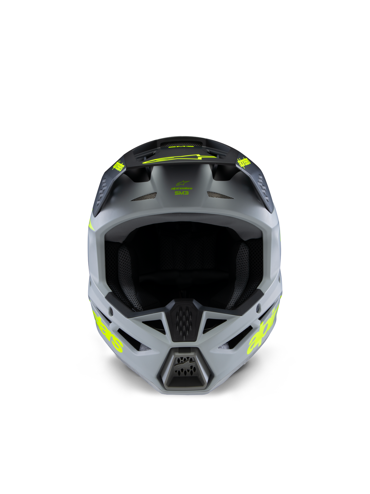 Casco Alpinestars S-M3 Juvenil Radium, casco de motocross, gris, negro y amarillo flúor mate, vista frontal con una calota angular agresiva, logotipos amarillos vibrantes en los laterales y la visera, acabado mate diseñado para carreras juveniles de motocross y off-road