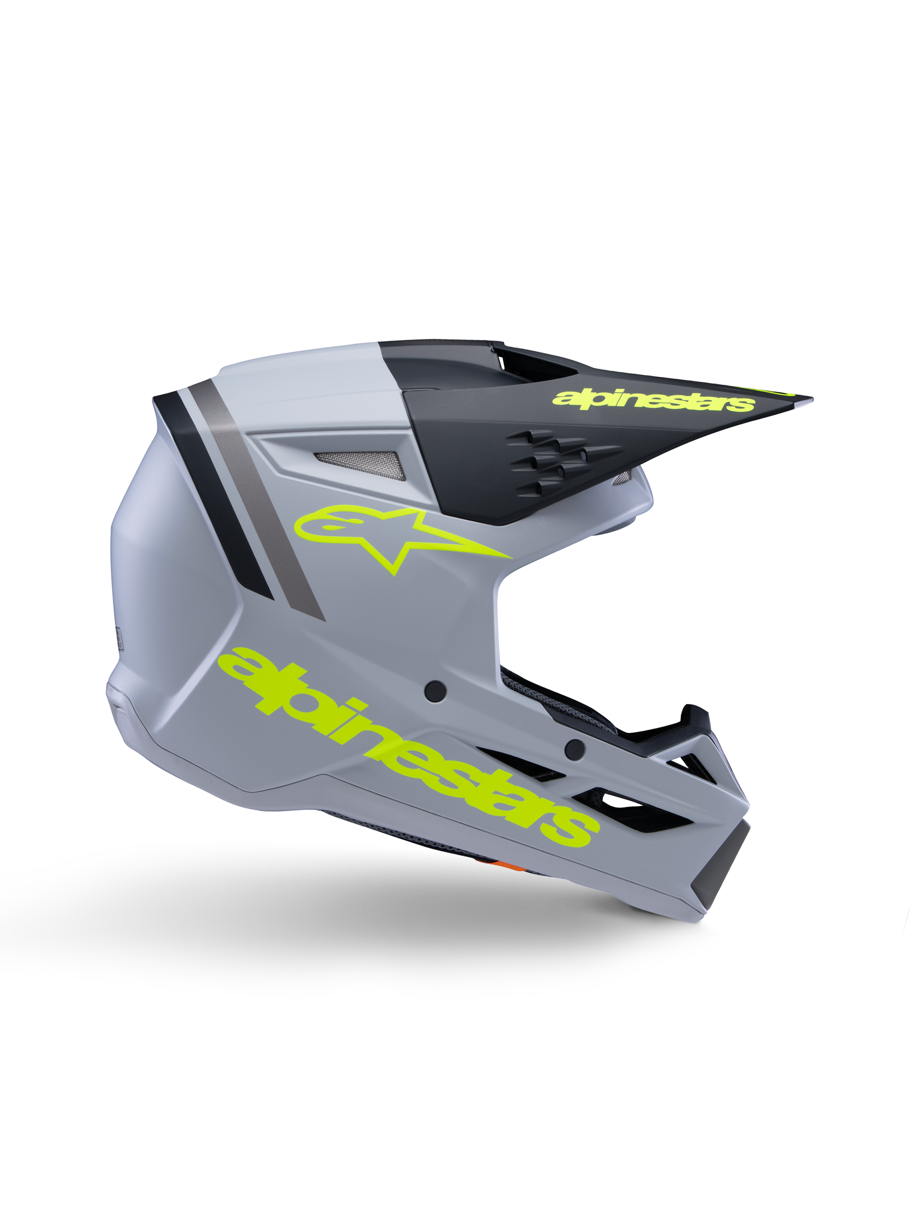 Alpinestars S-M3 Youth Radium Helmet ECE 22.06, casco de motocross juvenil, gris mate y negro con logotipos en amarillo flúor, perfil lateral que muestra el logotipo y el texto de Alpinestars, diseño aerodinámico con ventilación integrada y visera negra.