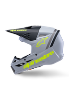 Casco Alpinestars S-M3 Juvenil Radium ECE 22.06, casco de motocross, gris, negro y amarillo flúor mate, vista lateral con logotipos Alpinestars en amarillo fluorescente y visera negra, equipo de protección aerodinámico para jóvenes pilotos
