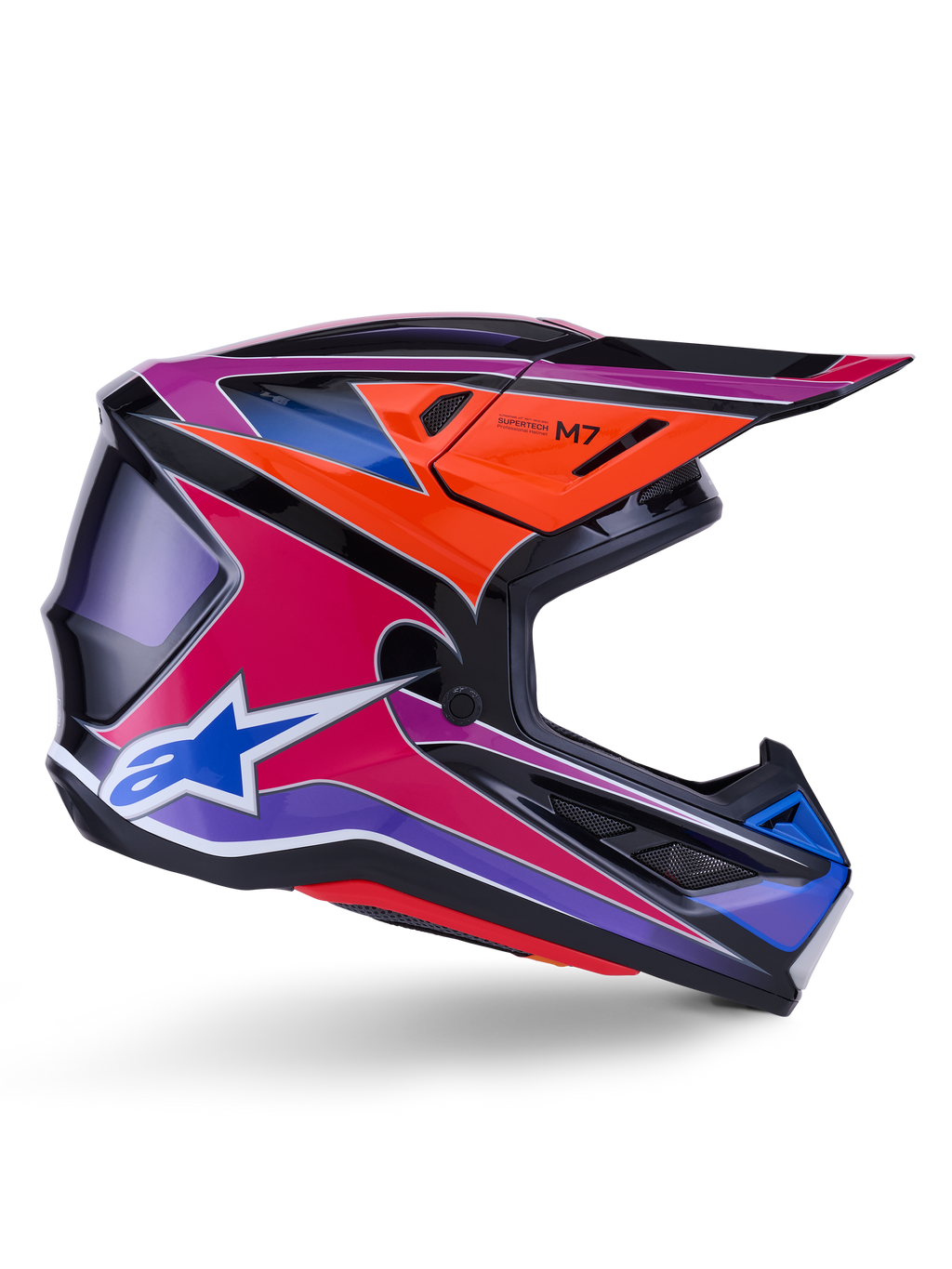 Casco Alpinestars S-M7 Fuse, casco de motocross, azul, púrpura y rosa brillante, vista de perfil lateral con gráficos de carreras vibrantes, diseño de calota aerodinámica con puertos de ventilación y logo de la estrella Alpinestars