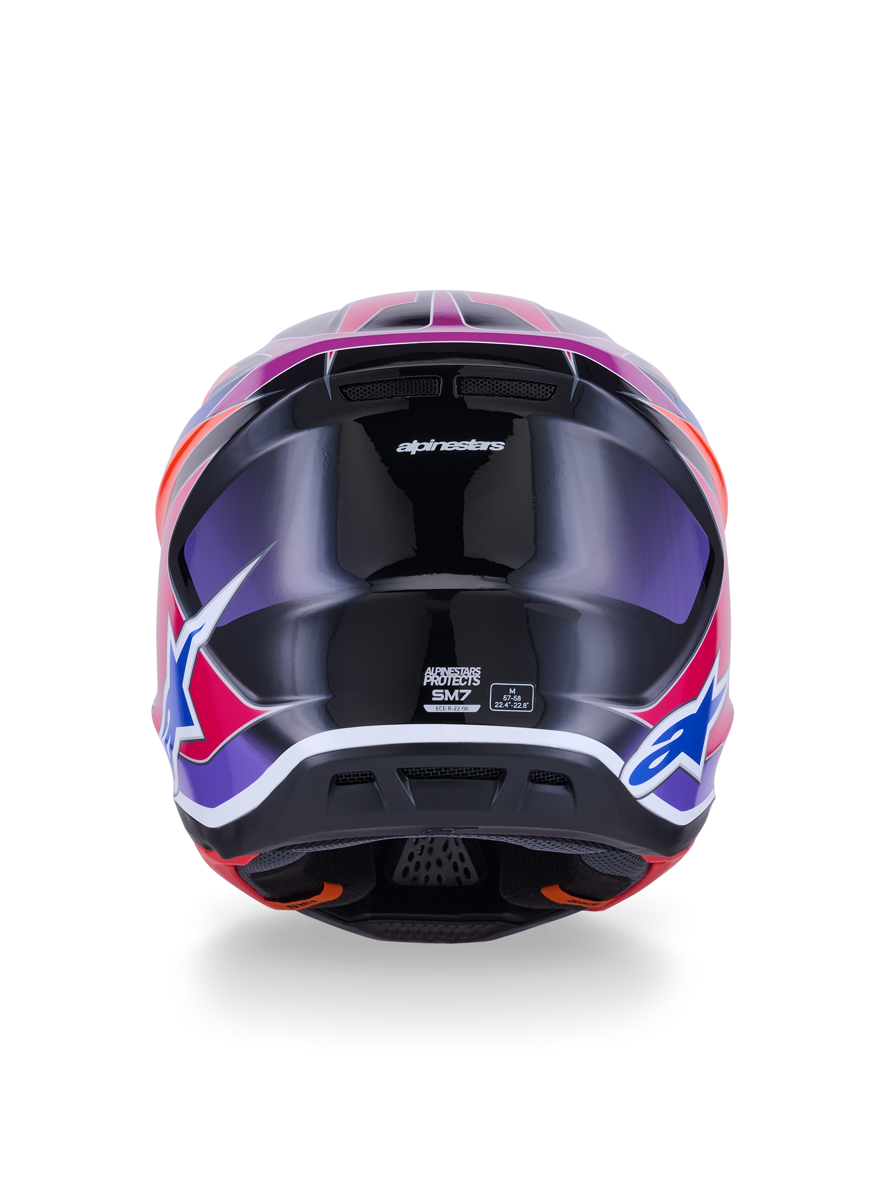 Casco Alpinestars S-M7 Fuse, casco de motocross, vista trasera, azul púrpura rosa brillante, gráficos vibrantes en rosa y púrpura sobre una calota negra brillante, con puertos de ventilación y etiqueta de certificación ECE 22.06