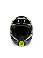 Casco Alpinestars S-M3 Youth Wurx, vista frontal, negro con detalles en amarillo fluorescente, azul y rojo, equipo de protección de motocross para jóvenes, con base negra y gráficos geométricos vibrantes, puertos de ventilación integrados y mentonera amarilla, estilo de carreras todoterreno