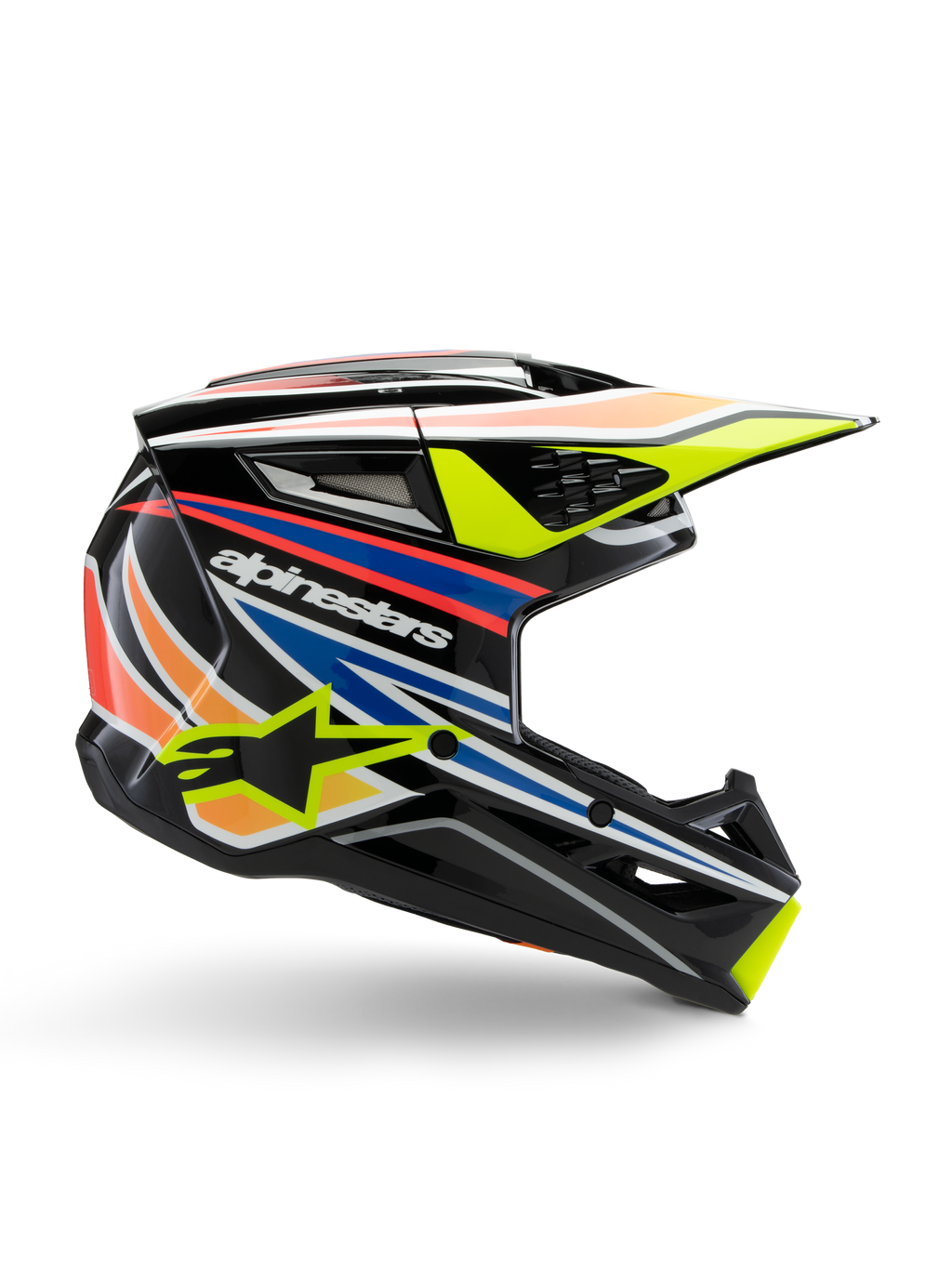 Casco Alpinestars S-M3 Youth Wurx, casco de motocross juvenil, negro con franjas gráficas amarillas, azules, rojas y naranjas, perfil lateral con visera aerodinámica y acabado brillante, con logotipo blanco de Alpinestars y gráfico de estrella amarilla