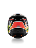 Alpinestars S-M3 Youth Wurx Helmet ECE 22.06, casco de motocross, vista trasera, negro con gráficos en rojo, amarillo fluorescente y azul, con patrones angulares llamativos, logotipos de estrellas y adhesivo de certificación ECE 22.06, diseñado para competiciones todoterreno juveniles