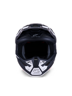 Alpinestars S-M7 Dasher Helmet ECE 22.06, casco de motocross, negro mate y blanco, vista frontal que muestra los puertos de ventilación y gráficos geométricos, incluye el texto "ONE GOAL - ONE VISION", protección profesional para carreras off-road