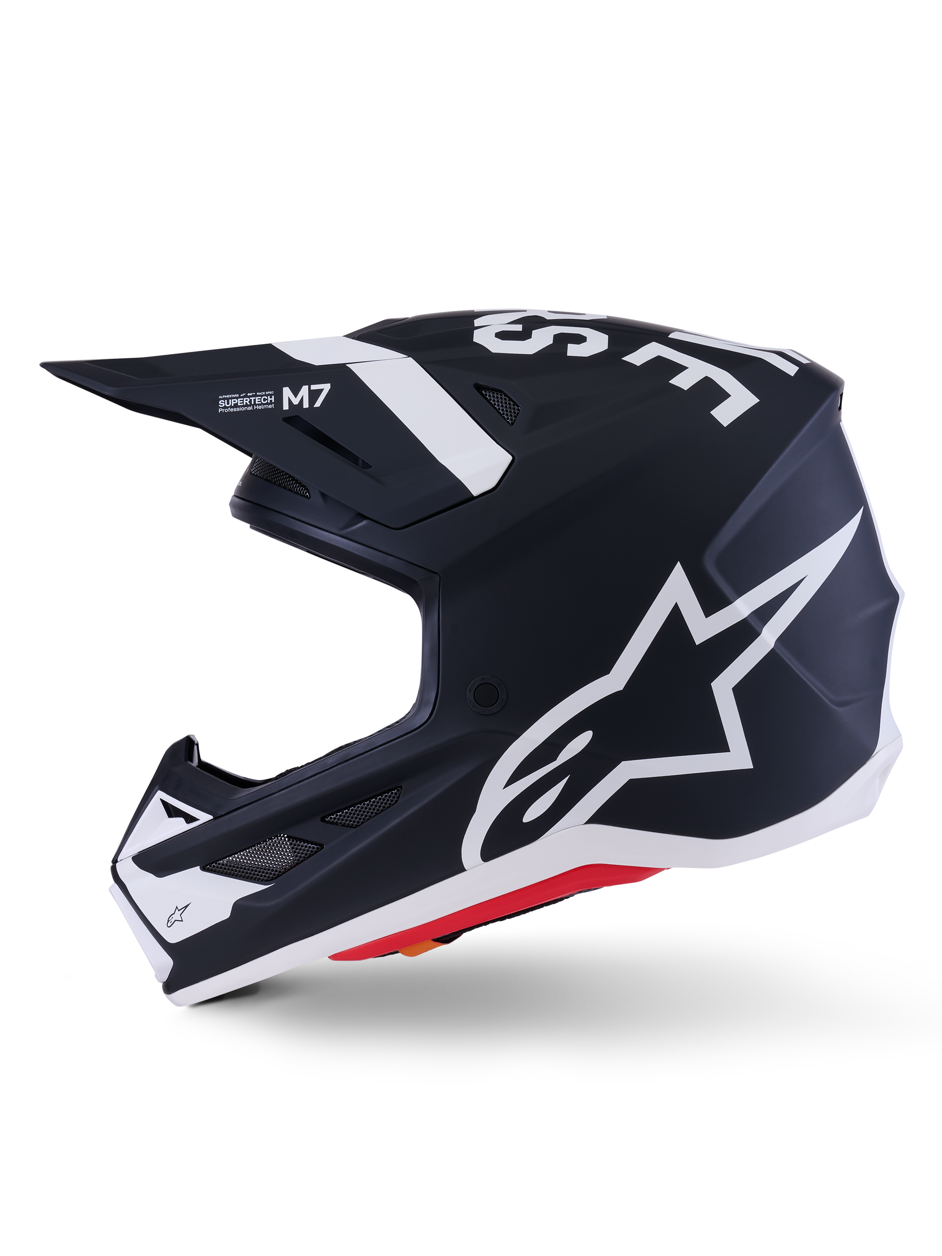 Casco Alpinestars S-M7 Dasher ECE 22.06, negro mate y blanco, perfil lateral con el logotipo grande de Alpinestars en blanco, calota de compuesto aerodinámico con puertos de ventilación y borde inferior rojo, protección profesional para motocross