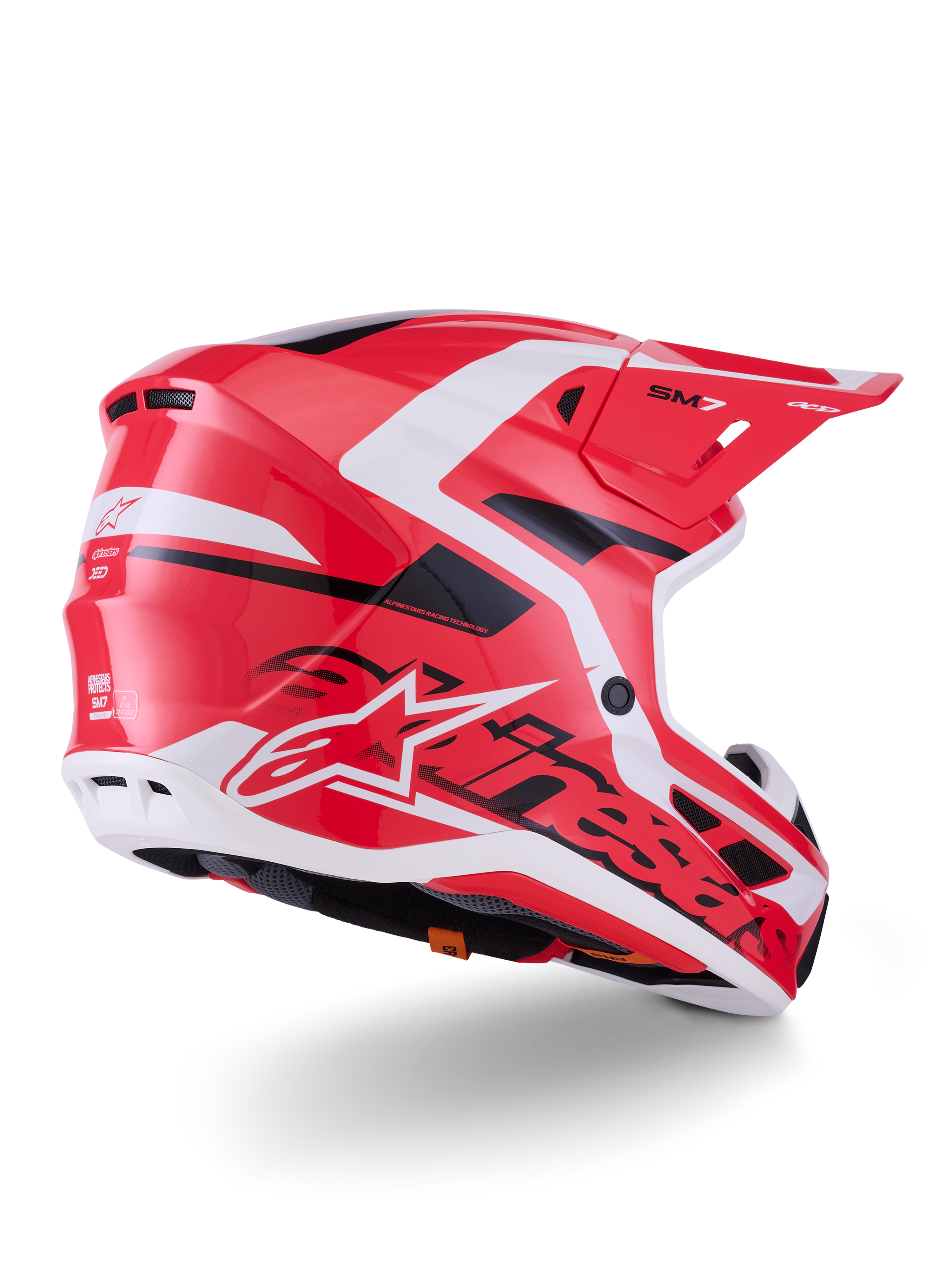 Casco Alpinestars S-M7 Deed, casco de motocross, rojo, negro y blanco brillante, con carcasa aerodinámica, puertos de ventilación y logotipos distintivos de Alpinestars, vista trasera de tres cuartos