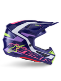 Casco Alpinestars S-M7 Deed, casco de motocross, púrpura y rosa brillante, vista de perfil lateral, con detalles gráficos en blanco y verde lima, marca SM7 y logotipo de Alpinestars, diseño de calota de composite aerodinámica para carreras off-road