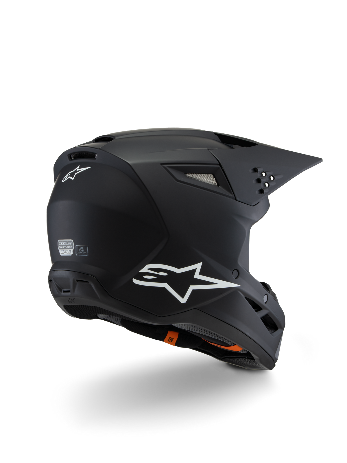 Casco Alpinestars S-M3 Youth Solid ECE 22.06, casco de motocross, negro mate, vista trasera de tres cuartos con logotipos de Alpinestars en blanco, diseño de calota estilizado con visera integrada y puertos de ventilación, equipo de protección todoterreno para jóvenes