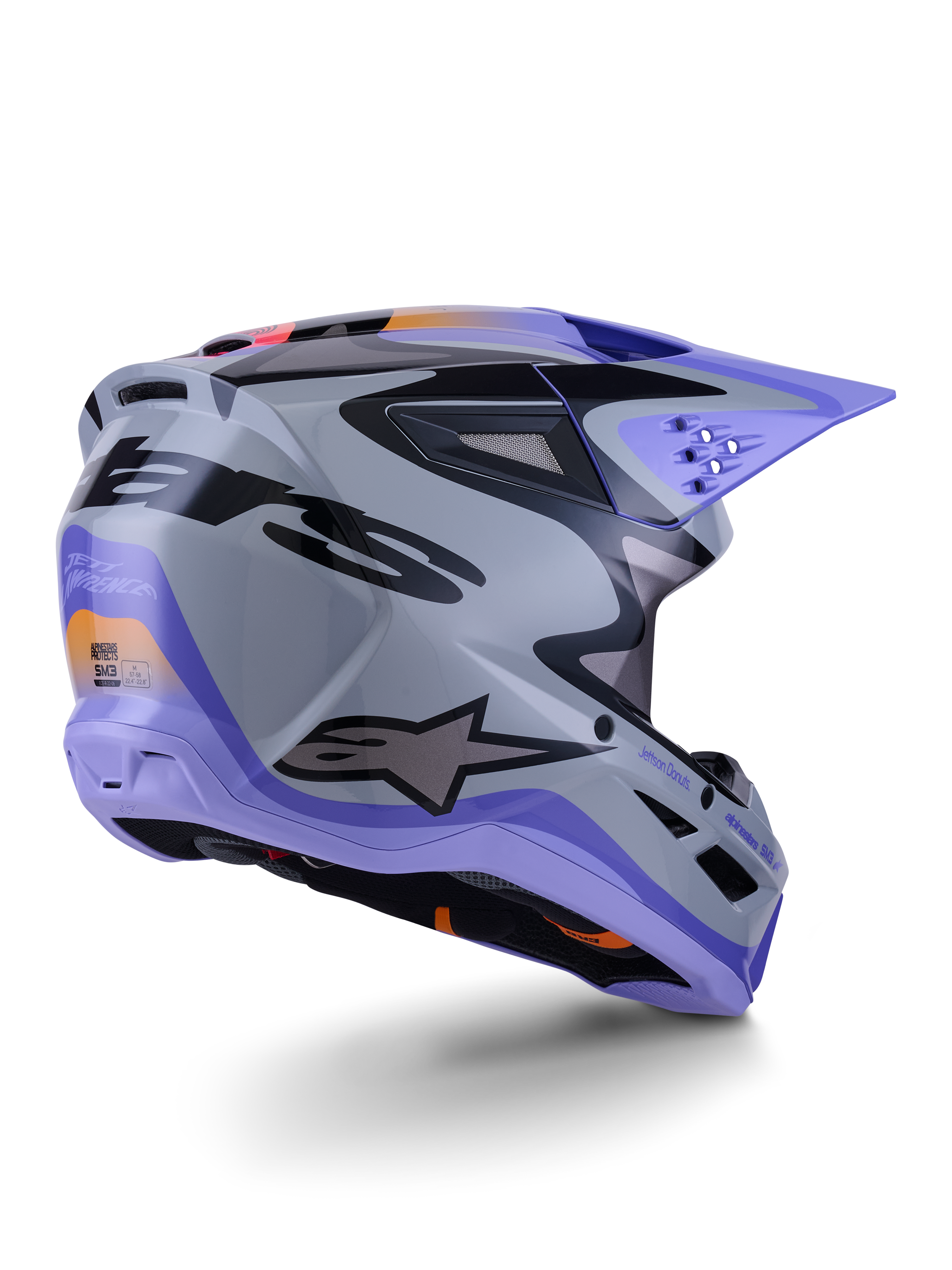 Alpinestars S-M3 Jettson Helmet ECE 22.06, casco de motocross, gris, morado y negro brillante, vista trasera de tres cuartos que muestra la carcasa aerodinámica termoinyectada con puertos de ventilación y un diseño gráfico audaz