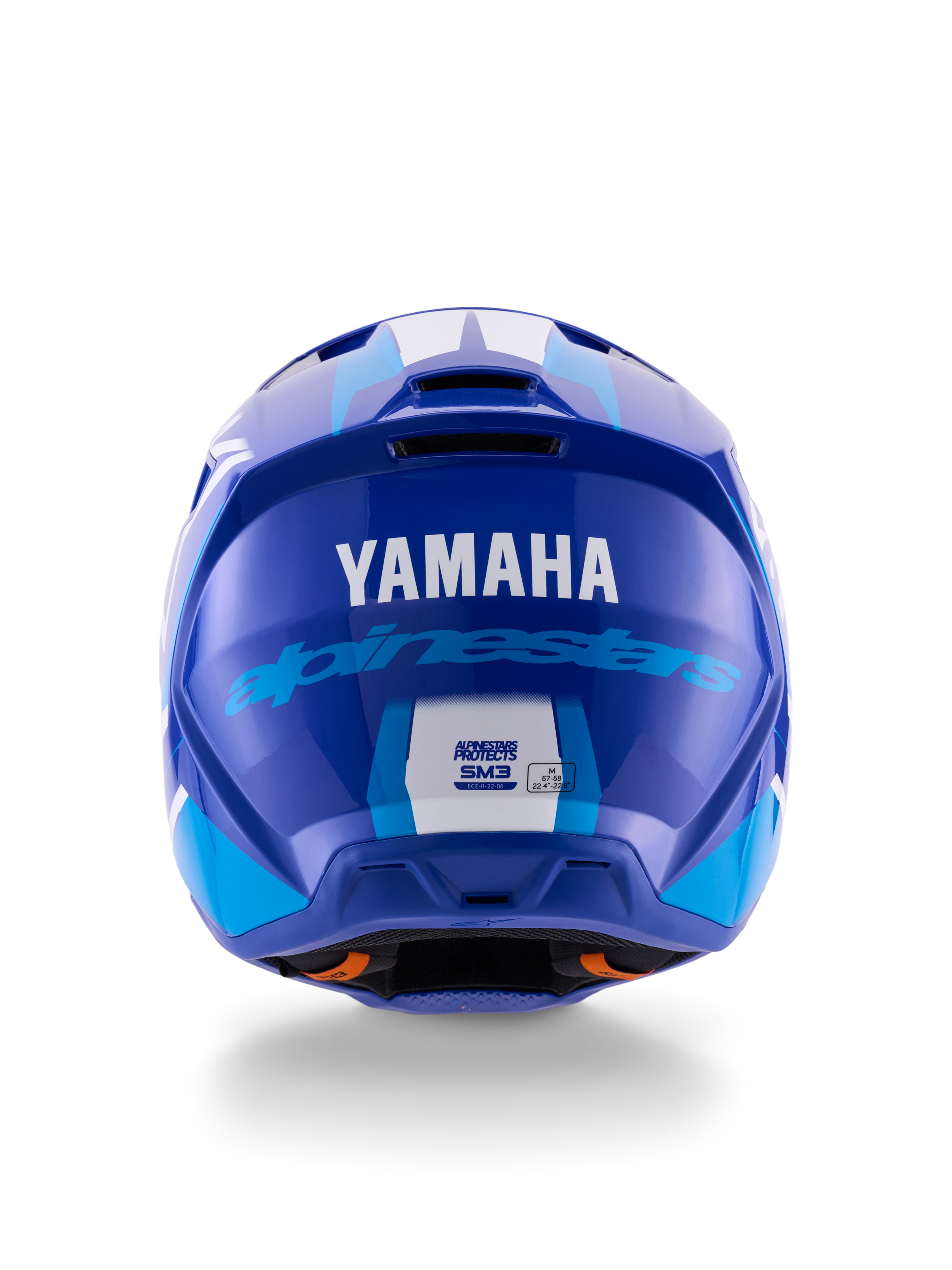 Casco Alpinestars Yamaha S-M3, casco de motocross, azul y blanco brillante, vista trasera que muestra el logotipo blanco de YAMAHA y la inscripción azul de Alpinestars, acabado brillante con puertos de ventilación y etiquetas de certificación de seguridad visibles.