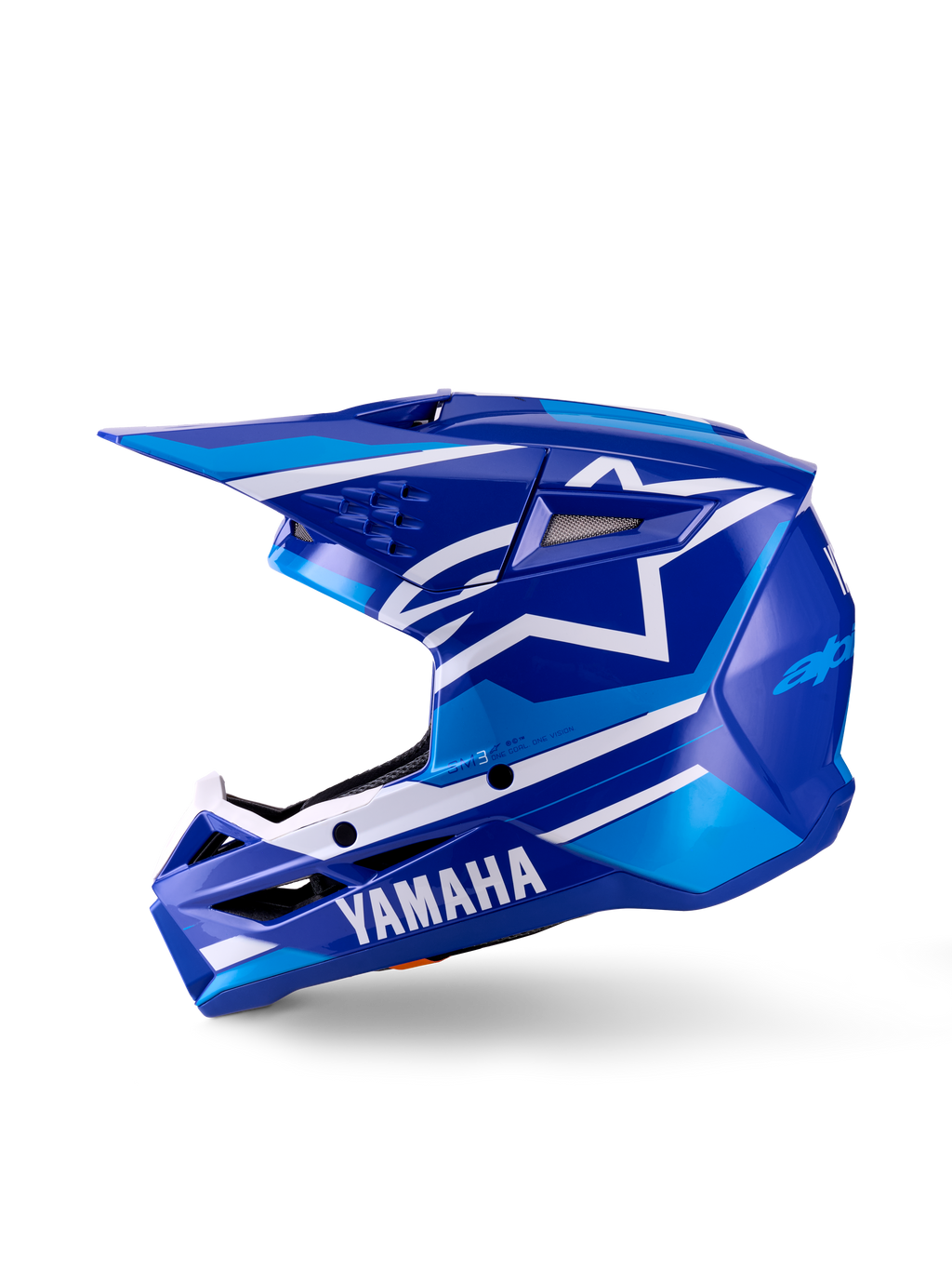 Casco de Motocross Yamaha S-M3 Juvenil, azul y blanco brillante, vista de perfil lateral, con marca Yamaha destacada en la mentonera y logo de la estrella de Alpinestars, calota aerodinámica con múltiples puertos de ventilación y visera integrada.