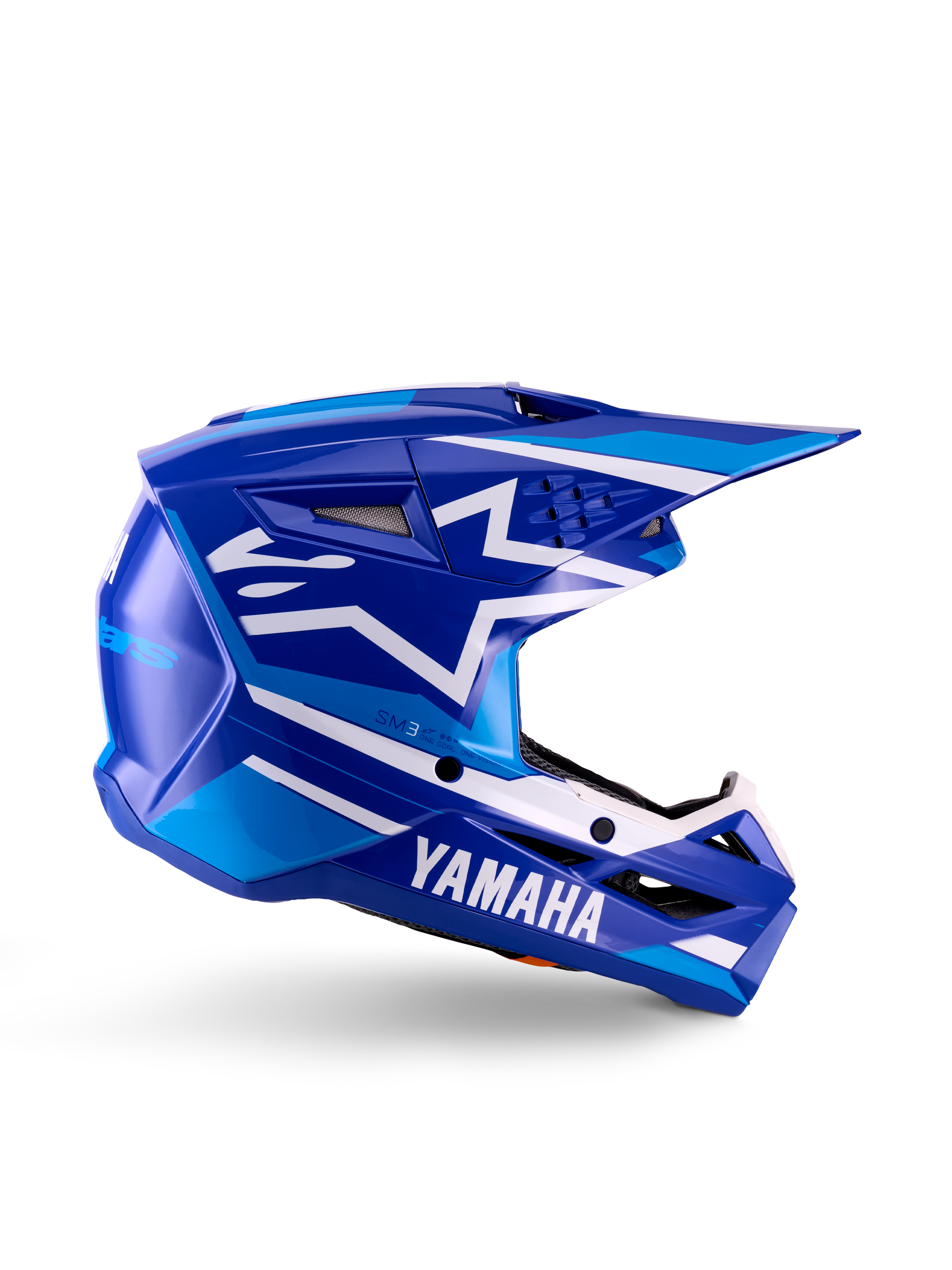 Casco de motocross juvenil Yamaha S-M3, azul y blanco brillante, vista de perfil lateral con marca Yamaha destacada y logo de estrella de Alpinestars, diseño geométrico con detalles en azul claro, calota ventilada con visera larga, protección para la cabeza off-road certificada ECE 22.06