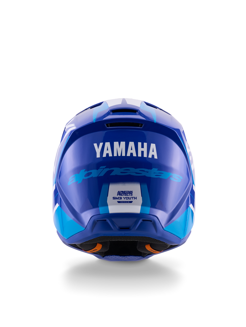 Casco de motocross juvenil Yamaha S-M3, vista trasera, azul y blanco brillante, con logotipos destacados de Yamaha y Alpinestars, diseño de calota aerodinámica con etiqueta de certificación de seguridad ECE 22.06, protección profesional para carreras todoterreno