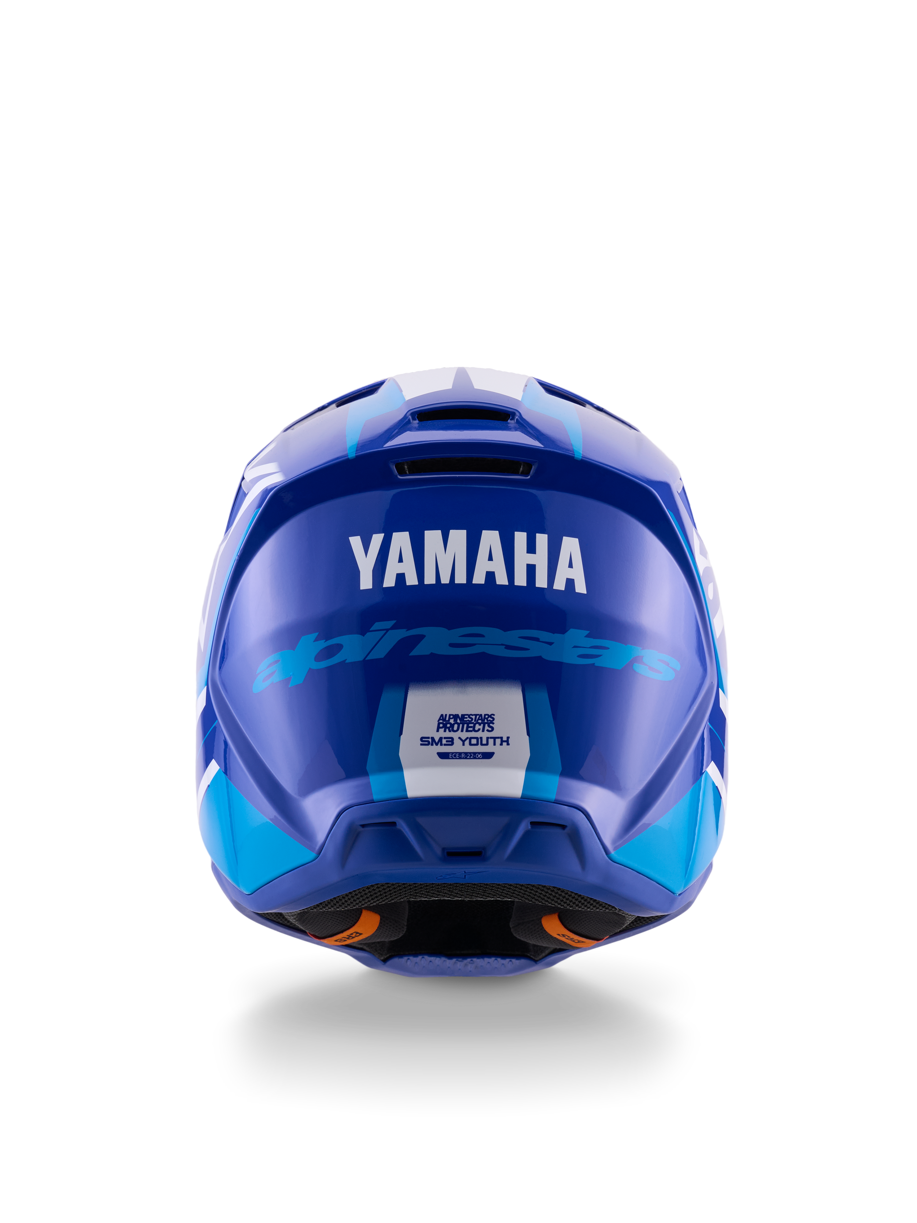 Casco de motocross juvenil Yamaha S-M3, vista trasera, azul y blanco brillante, con logotipos destacados de Yamaha y Alpinestars, diseño de calota aerodinámica con etiqueta de certificación de seguridad ECE 22.06, protección profesional para carreras todoterreno