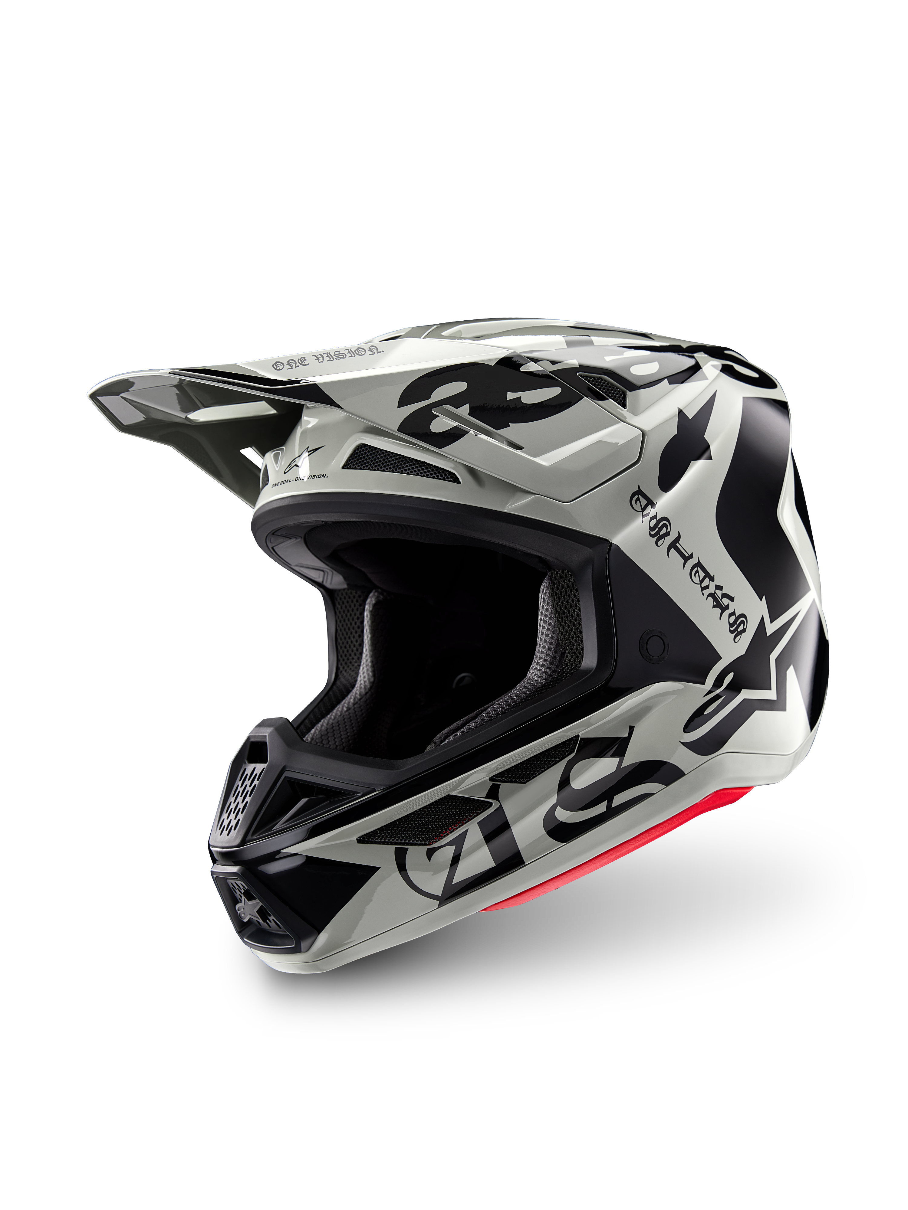 Casco Alpinestars Edición Limitada S-M7 Wolf Dust, casco de motocross, Dune Black Glossy, calota gris claro con letras 'ASTARS' de estilo gótico y logotipo de estrella en negro, detalle rojo en el borde inferior, con visera de alto rendimiento y múltiples entradas de aire, vista frontal de tres cuartos