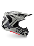 Casco Alpinestars Edición Limitada S-M7 Wolf Dust, casco de motocross en color Dune Black Glossy, perfil lateral con gráficos negros llamativos y logotipos de la marca, acentos rojos en la base, protección aerodinámica para la cabeza off-road