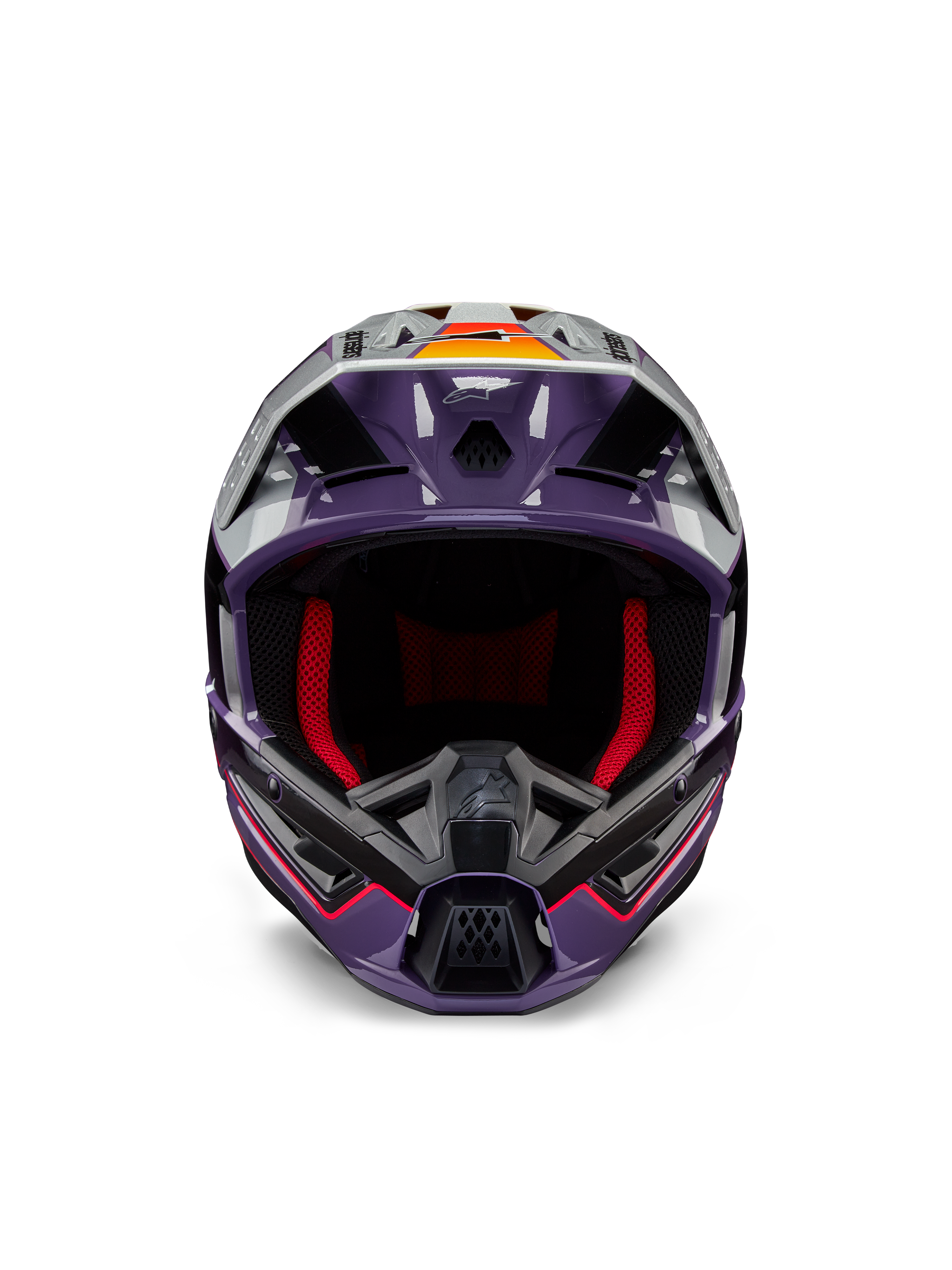Alpinestars S-M5 Sail Helmet ECE, casco de motocross, violeta, negro y plateado brillante, vista frontal con acolchado interior rojo, mentonera ventilada y visera con detalles en naranja, calota aerodinámica elegante para protección todoterreno
