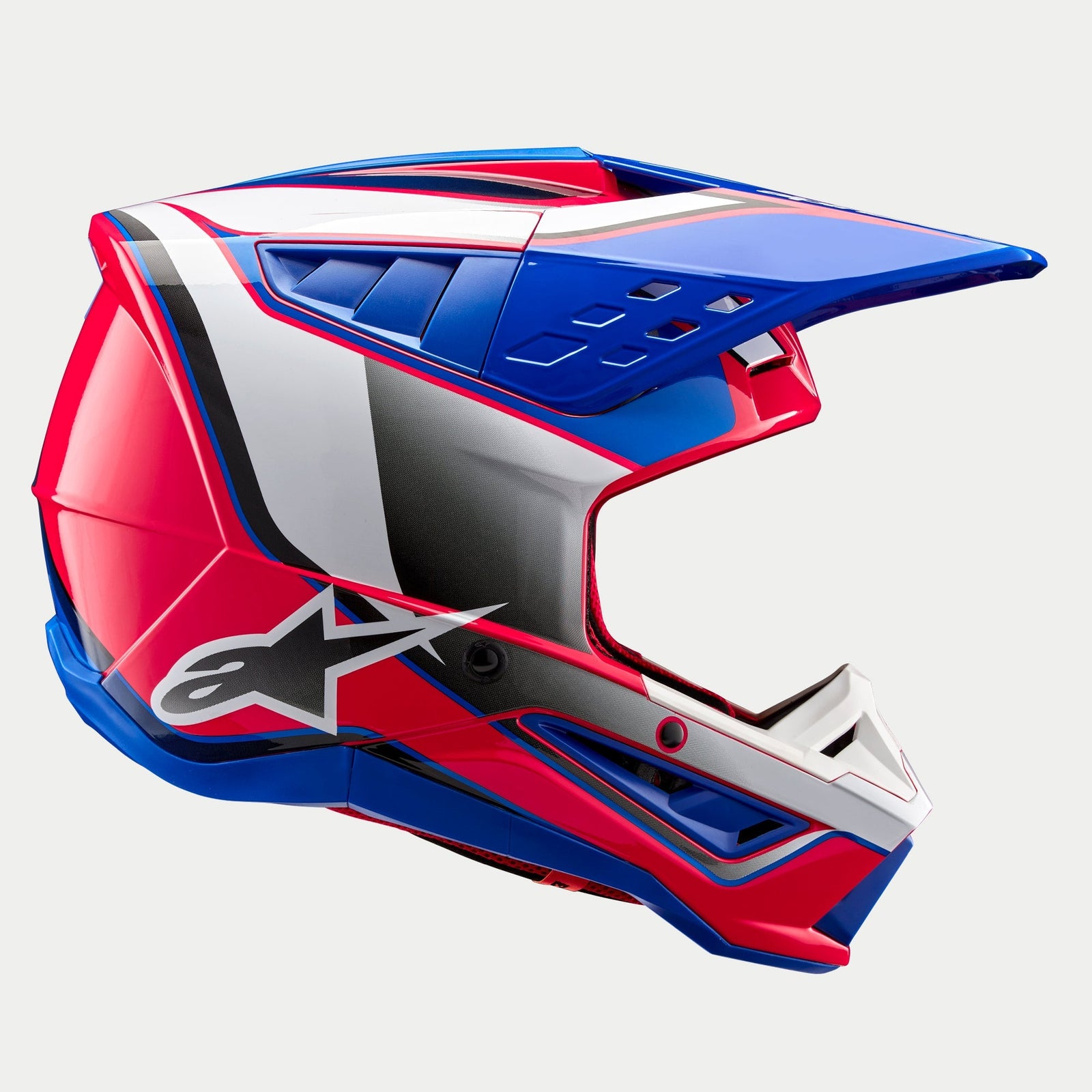 Alpinestars S-M5 Sail Helmet ECE, casco de motocross, gráficos brillantes en blanco, rosa diva y azul esmalte, vista de perfil lateral con visera aerodinámica y puertos de ventilación, logotipo de la estrella de Alpinestars destacado