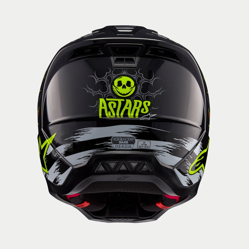 Alpinestars S-M5 Rash Helmet ECE, Motocross Helmet, Rear view, Glossy Dark Gray with bright yellow-green skull and ASTARS logo, gray brushstroke graphics, red interior padding, ECE 22.06 certified
