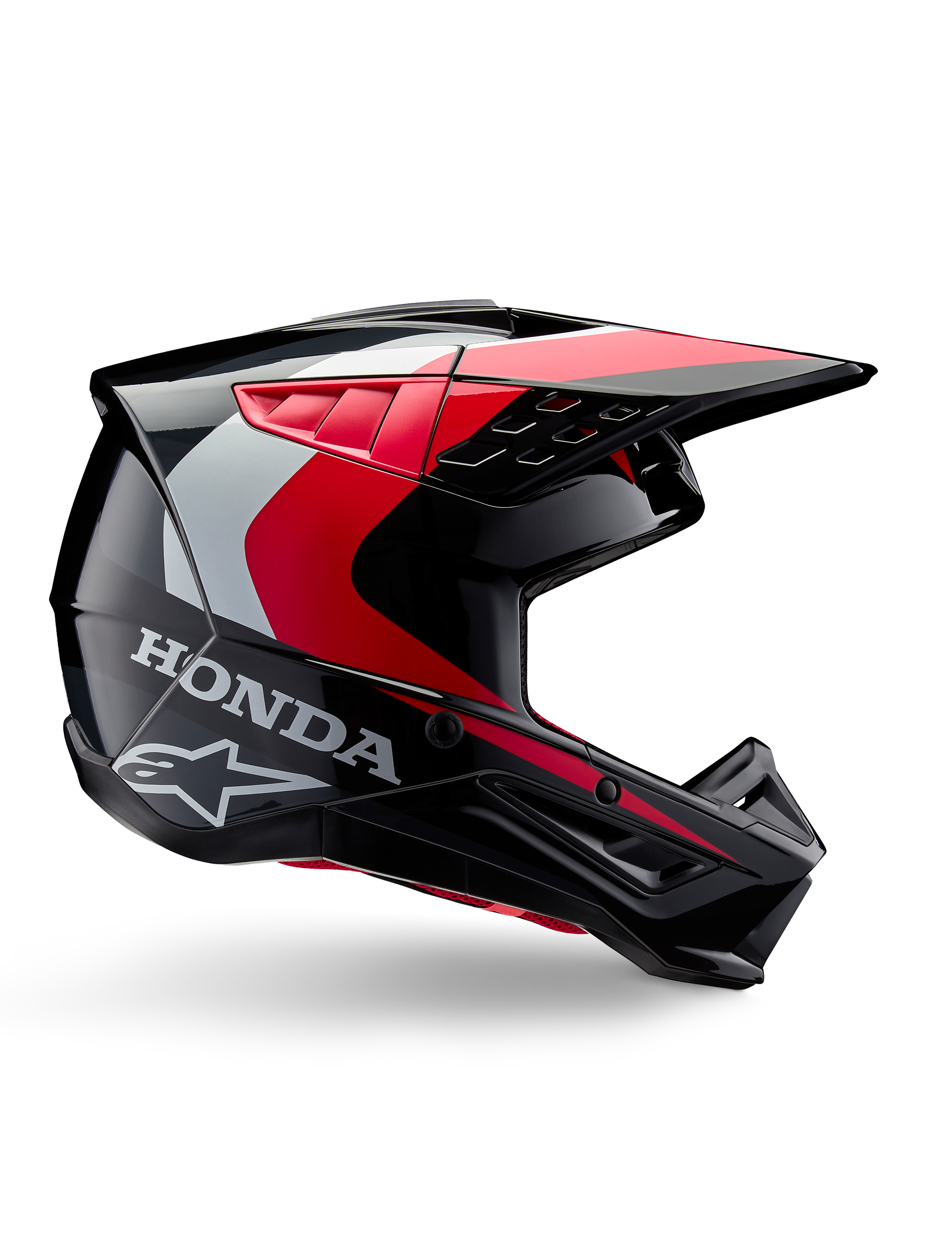 Casco Honda S-M5, casco de motocross, negro y rojo brillante con detalles en blanco y plata, vista lateral con los logotipos de Honda y Alpinestars, diseño aerodinámico con visera y múltiples puertos de ventilación, equipo de protección profesional para todoterreno