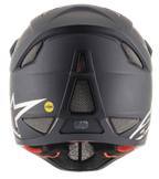 Casco Alpinestars Missile Tech Solid negro mate, vista trasera con aberturas de malla y logo MIPS para descenso MTB.