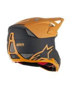 Casco Alpinestars Missile Tech Racer, casco de MTB integral, negro y dorado oscuro mate, vista lateral trasera con puertos de ventilación de malla, visera aerodinámica y logotipo Alpinestars Protects en la parte posterior, protección profesional para ciclismo de descenso.