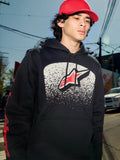 Sudadera con capucha Alpinestars Obsessed, forro polar negro, gráfico en el pecho con degradado MX blanco y logotipo de estrella roja, logotipos rojos en las mangas, ropa urbana casual de inspiración motorsport en un entorno urbano