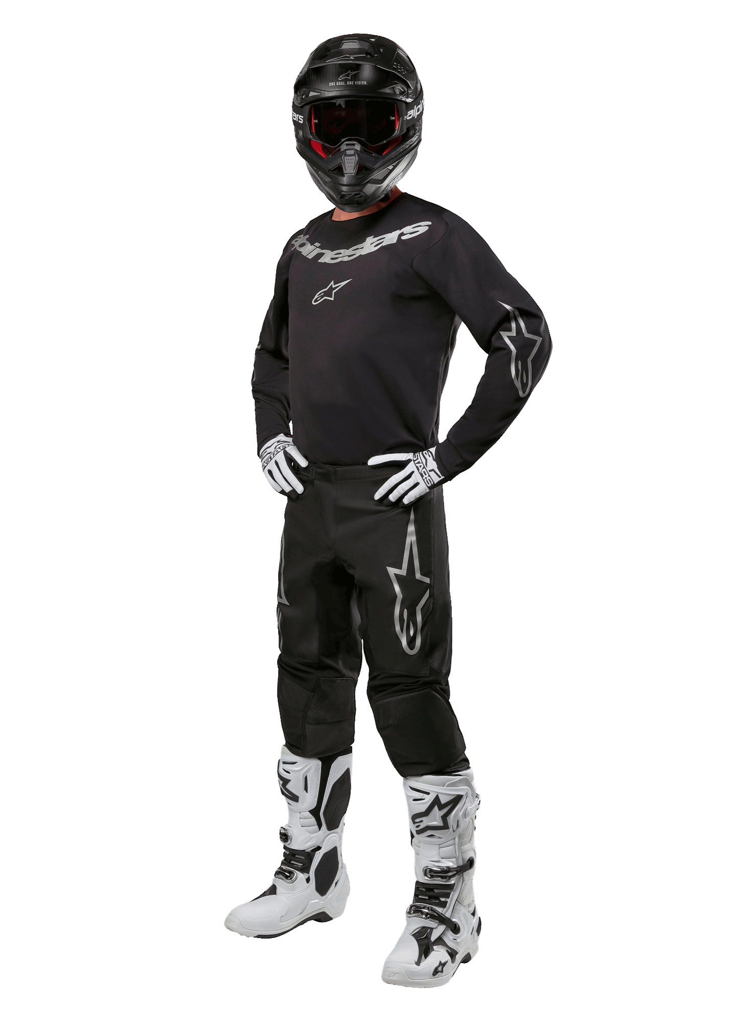 Alpinestars 2024 Fluid Graphite Gear Set, equipo completo de carreras de motocross, negro con logotipos grises y blancos, con jersey y pantalones usados con casco negro a juego, guantes y botas blancas y negras, diseñado para protección todoterreno