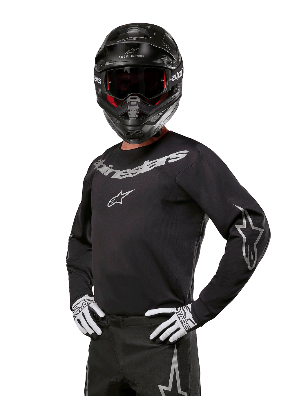 Alpinestars 2024 Fluid Graphite Gear Set, piloto de motocross con jersey negro y gris con logotipos grises llamativos, casco negro y guantes blancos y negros, ajuste deportivo atlético para carreras de motocross todoterreno
