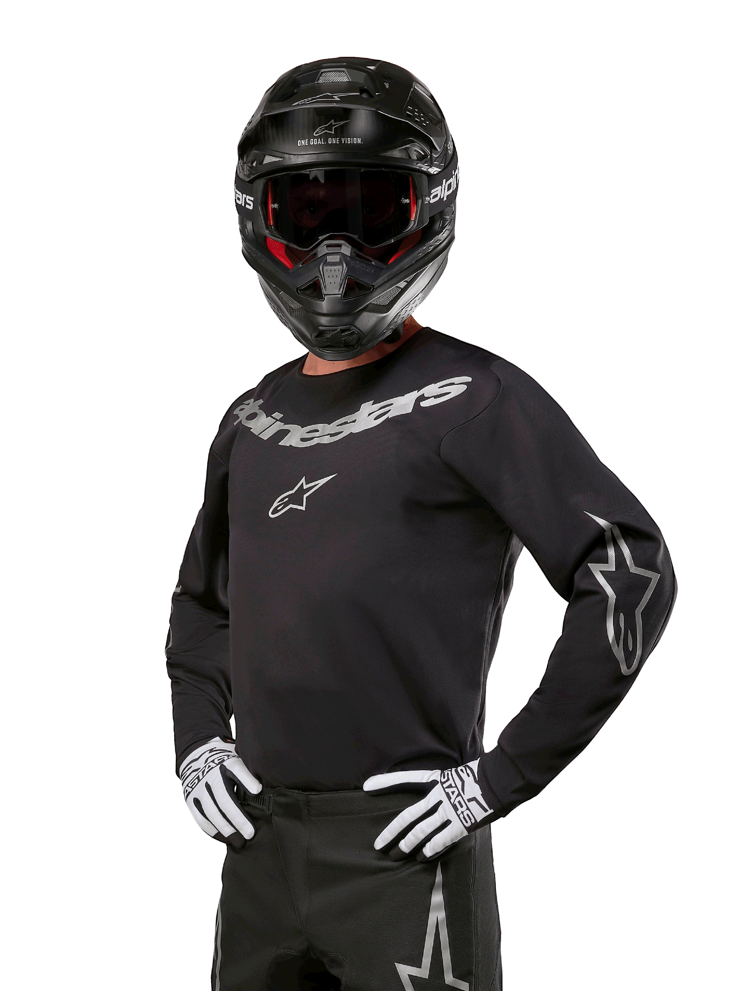 Alpinestars 2024 Fluid Graphite Gear Set, piloto de motocross con jersey negro y gris con logotipos grises llamativos, casco negro y guantes blancos y negros, ajuste deportivo atlético para carreras de motocross todoterreno