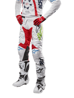 2024 Racer Hana Pants, Motocross Racing Pants, White with Red Blue and Lime Green accents, featuring protective design with leather knee panels, worn with matching jersey, red gloves, and white boots with buckles, sporty motorsports outfit