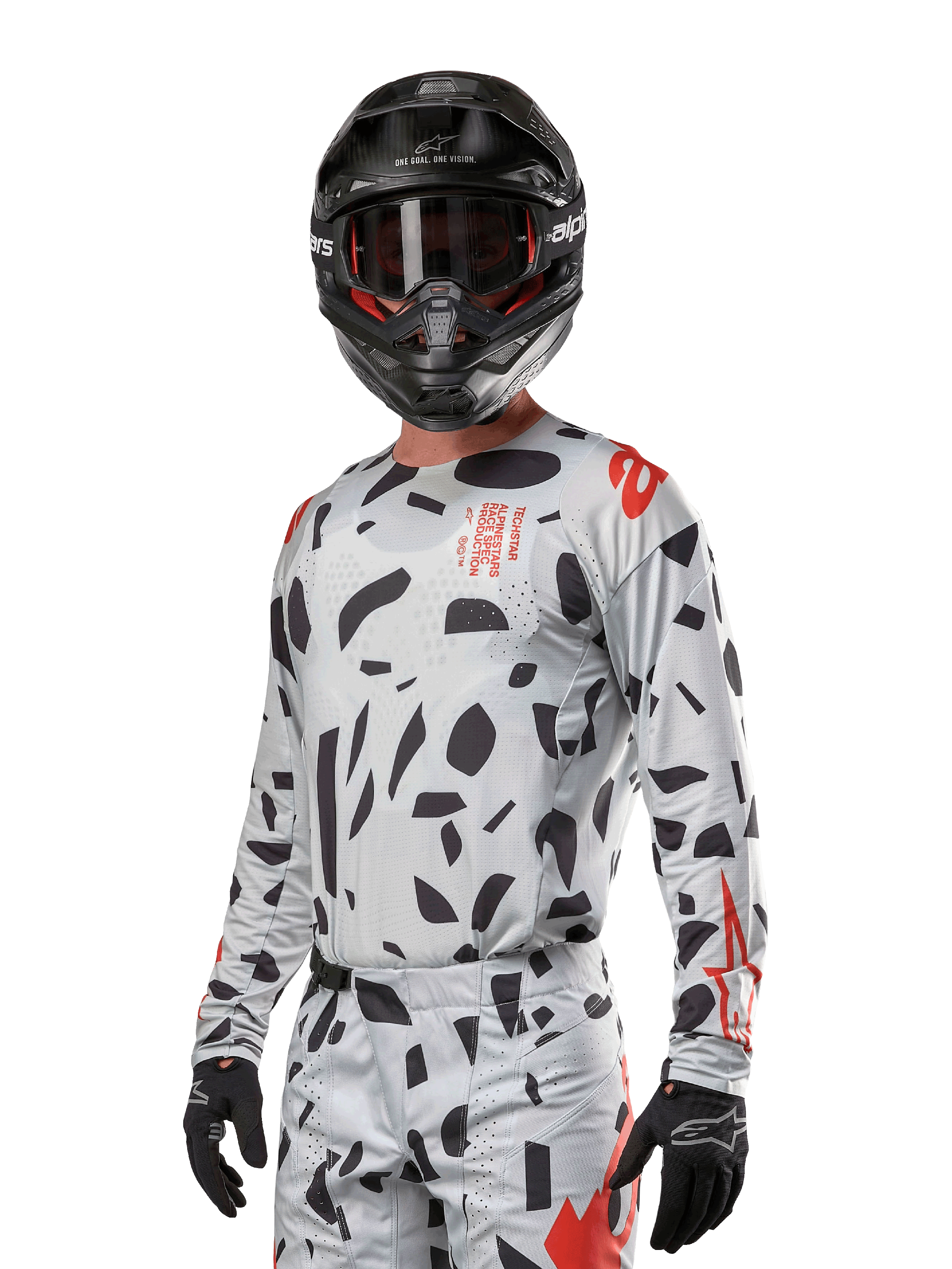 Alpinestars Techstar Rantera Jersey 2024, jersey de motocross en gris con patrones abstractos negros y acentos rojos, diseño de manga larga usado con casco y guantes negros, equipo técnico para carreras todoterreno