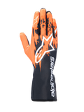 Guantes Alpinestars Tech-1 K V3, guantes de karting, negro, naranja y blanco, con un diseño gráfico sublimado con patrones de pinceladas naranjas sobre una base negra, logotipo Astar grande en blanco en el dorso, texto vertical de Alpinestars en el puño, equipo profesional para carreras de karting