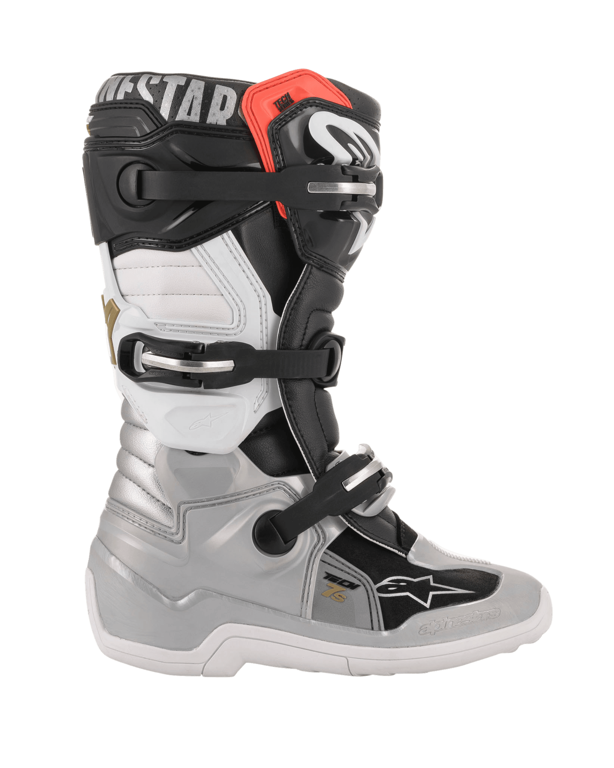 Botas Alpinestars Youth Tech 7S, botas de motocross para jóvenes, color negro, plata, blanco y dorado, vista de perfil lateral con carcasa inferior plateada, paneles superiores en negro y blanco, detalle rojo en el borde superior y sistema de cierre de tres hebillas