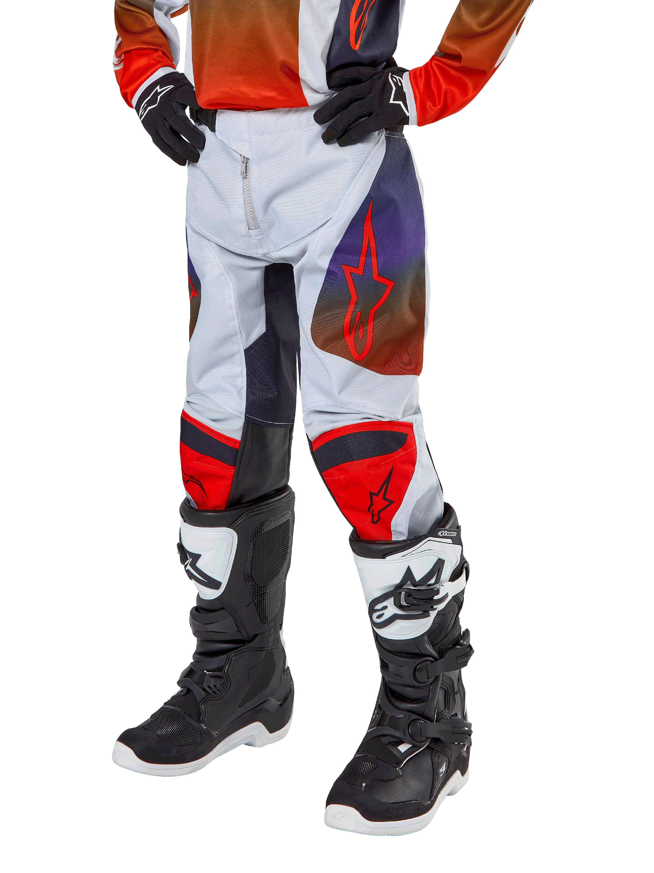Alpinestars 2024 Youth Racer Hoen Pants, Motocross Pants, Light Gray with Hot Orange and Black accents, featuring red star logos on thighs and red knee panels, worn with black and white boots, durable design for off-road racing