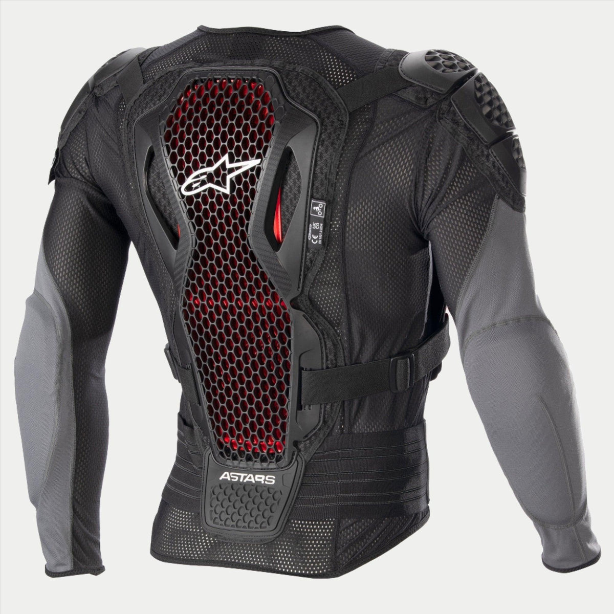 Alpinestars Bionic Plus V2 Protection Jacket, chaqueta de protección para motocross, negro y gris antracita con detalles de panal en rojo, vista posterior que muestra el protector de espalda con tecnología Nucleon Cell de Nivel 2, tejido de malla perforada y protecciones integradas en hombros y codos